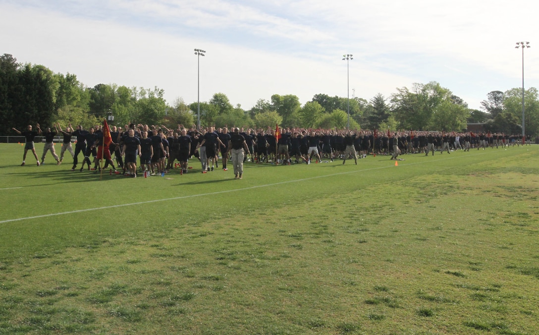 Marine Corps Recruiting Station Raleigh poolees do jumping jacks as they warm up for the statewide pool function at North Carolina State University in Raleigh, N.C., April 26, 2014. The statewide pool function is a competition between the 13 sub-stations of RS Raleigh that tests their poolee’s strength, conditioning and mental fortitude in a series of events. (U.S. Marine Corps photo by Sgt. Dwight A. Henderson/Released) 