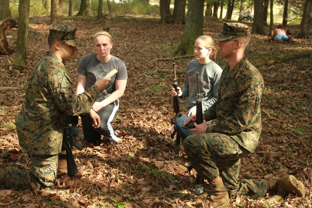 A group of future U.S. Marine Corps officer candidates plan a patrol during a small unit leadership class held during an Officer Candidates School preparatory weekend at Camp Woodward, Pa. April 25-27, 2014. The purpose of the weekend was to give the candidates a realistic view of how physically, mentally and emotionally demanding OCS will be. (U.S. Marine Corps photo by Sgt. Tyler Hlavac/Released)