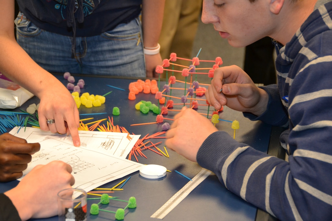 Students design and build a structure out of toothpicks and gum drops during Day with an Engineer. 