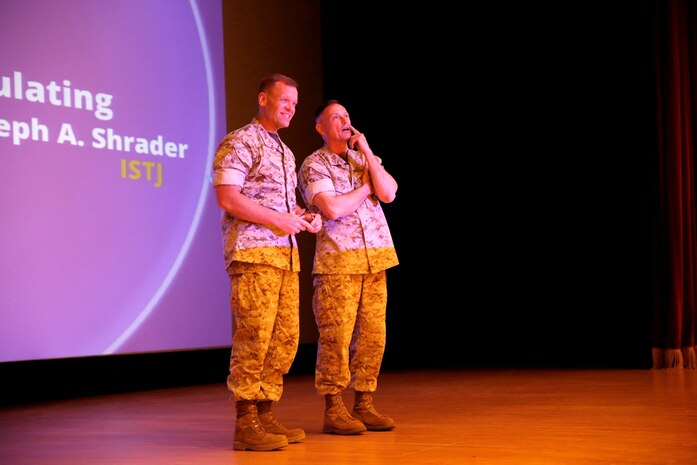 Brig. Gen. Frank Kelley (right), commander of Marine Corps Systems Command, introduces Col. Joseph Shrader at the April 30 MCSC Town Hall at Marine Corps Base Quantico, Va. Shrader has been selected for promotion to brigadier general and will assume command of MCSC in July.