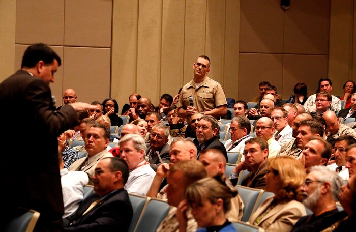 Jim Smerchansky (left), Marine Corps Systems Command deputy commander for Systems Engineering Interoperability, Architecture and Technology, answers audience questions at the April 30 MCSC Town Hall at Marine Corps Base Quantico, Va. 