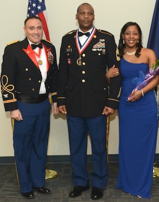 Col. Christopher Lestochi (left), Alaska District commander, was present for Master Sgt. Darnyell Parker's recognition of promotion to the rank of sergeant major at the Joint Chief Master Sergeant and Sergeant Major Recognition Ceremony Feb. 21 with Parker's wife, Michele, at Joint Base Elmendorf-Richardson, Alaska. Parker is currently the noncommissioned officer in charge of the district's Military Contingency Contracting Team that helps support the humanitarian assistance program in Southeast Asia.