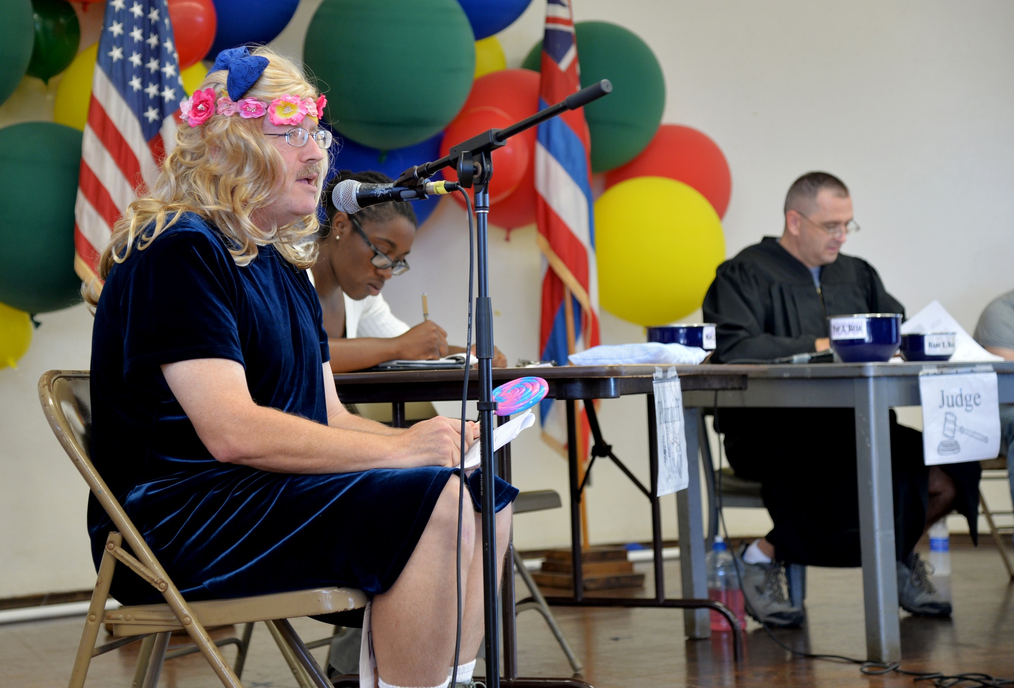 Col. Jeffrey Sattler, Pacific Air forces chief of international and operational law, gives his (her) testimony while playing the role of Goldilocks during a mock trial at Mokulele Elementary School on Joint Base Pearl Harbor-Hickam, Hawaii, May 1, 2014. Airmen from PACAF and 15th Wing legal offices hosted the trials in recognition of Law Day 2014, and to educate the students on the trial court process. The trials were based on the story of “Goldilocks and the Three Bears.” (U.S. Air Force photo/Staff Sgt. Alexander Martinez) 
