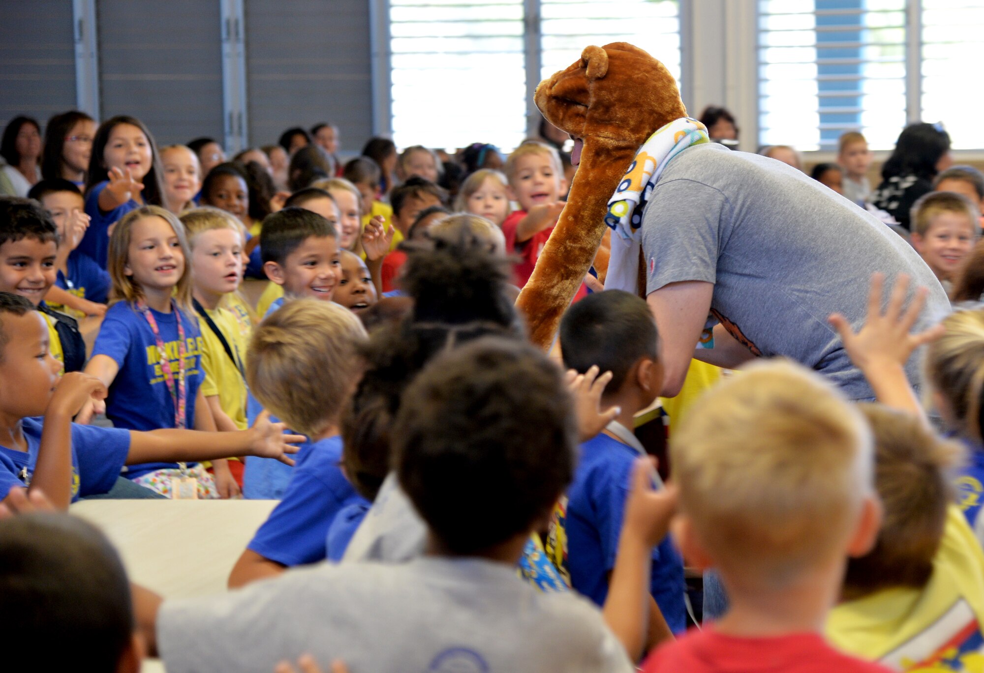 Capt. Casey Hinson, Pacific Air Forces Judge Advocate executive officer, interacts with elementary students while playing the role as Babe E. Bear during a mock trial at Mokulele Elementary School on Joint Base Pearl Harbor-Hickam, Hawaii, May 1, 2014. Airmen from PACAF and 15th Wing legal offices hosted the trials in recognition of Law Day 2014, and to educate the students on the trial court process. The trials were based on the story of “Goldilocks and the Three Bears.” (U.S. Air Force photo/Staff Sgt. Alexander Martinez) 