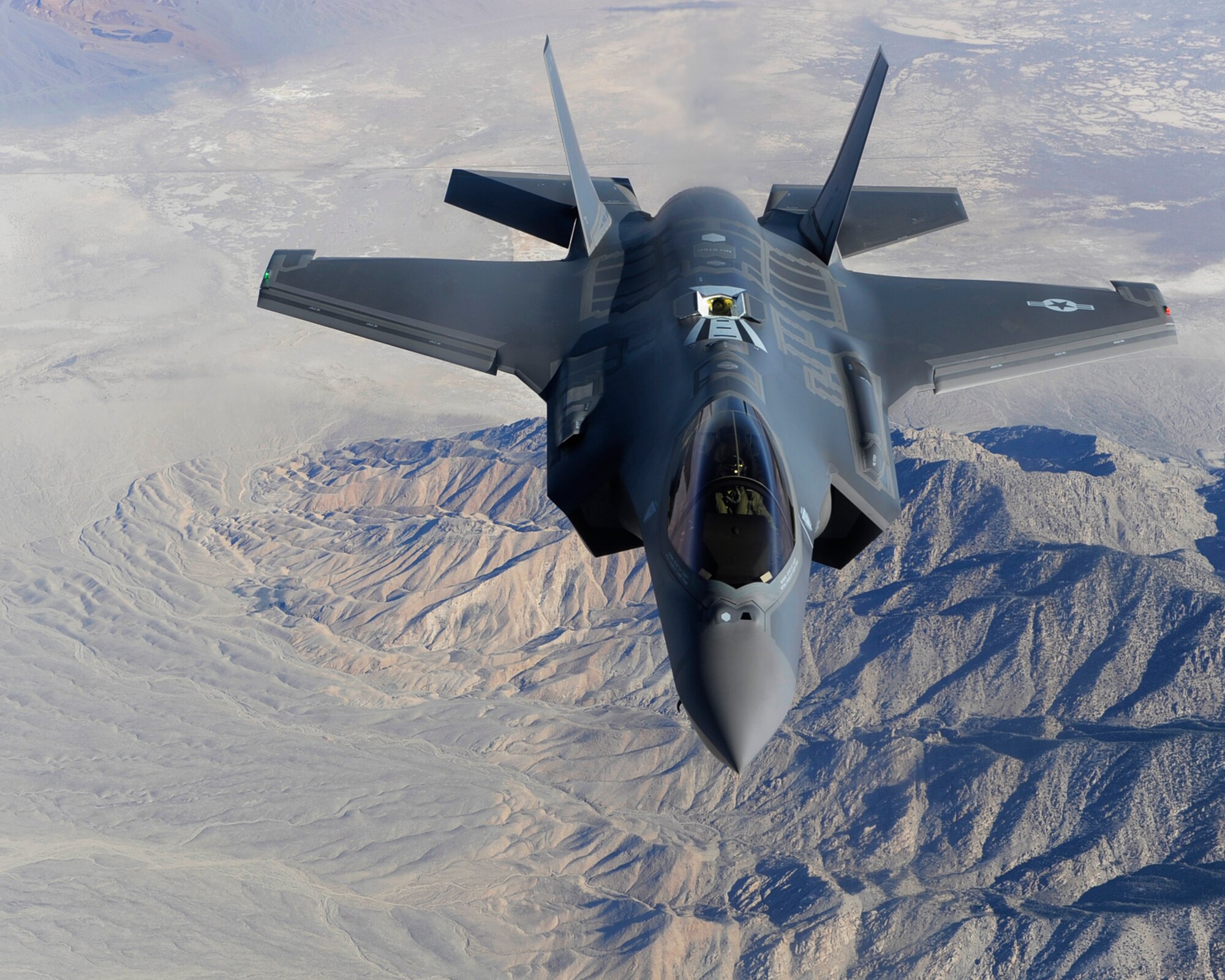 A U.S. Air Force F-35 Lightning II assigned to the 31st Test and Evaluation Squadron from Edwards Air Force Base, Calif. flies over the desert April 29, 2014, over the California desert. Some of the capabilities of the F-35 include a range of more than 1,200 nautical miles, a top speed of Mach 1.6 and an 18,000 lb. internal weapons payload. (U.S. Air Force photo by Airman 1st Class Thomas Spangler)