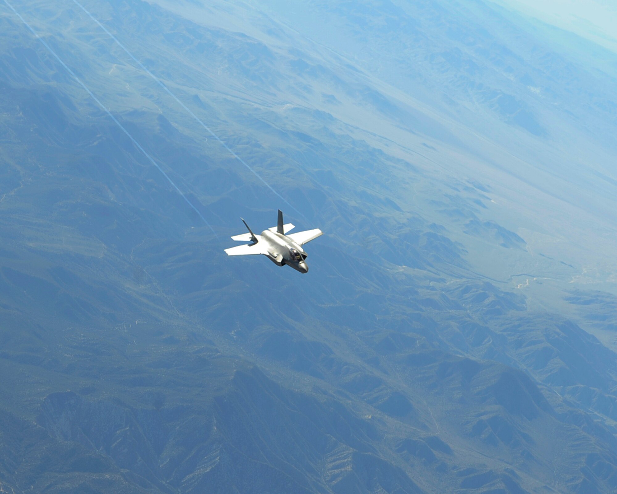 A U.S. Air Force F-35 Lightning II assigned to the 31st Test and Evaluation Squadron from Edwards Air Force Base, Calif. soars through the sky over the California desert April 29, 2014. The F-35 is a 5th generation multi-role fighter capable of dominating combat air-space with radar-evading stealth and supersonic speed. (U.S. Air Force photo by Airman 1st Class Thomas Spangler)