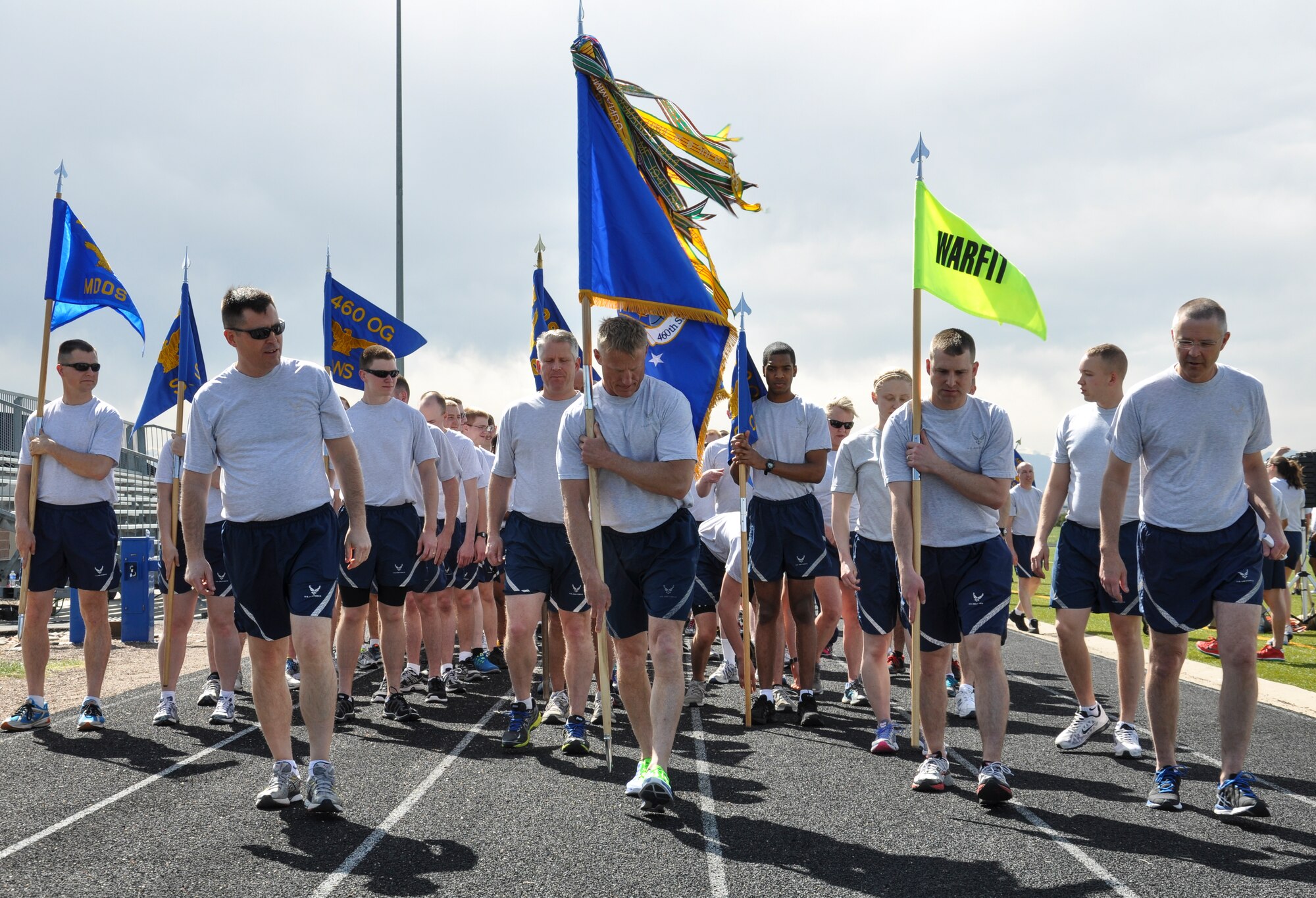 Team Buckley members prepare at the start of a 2.5-mile WarFit formation run April 25, 2014, at the base track on Buckley Air Force Base, Colo. The workout included segments on base history and stops for anaerobic exercises. (U.S. Air Force photo by Staff Sgt. Nicholas Rau/Released)