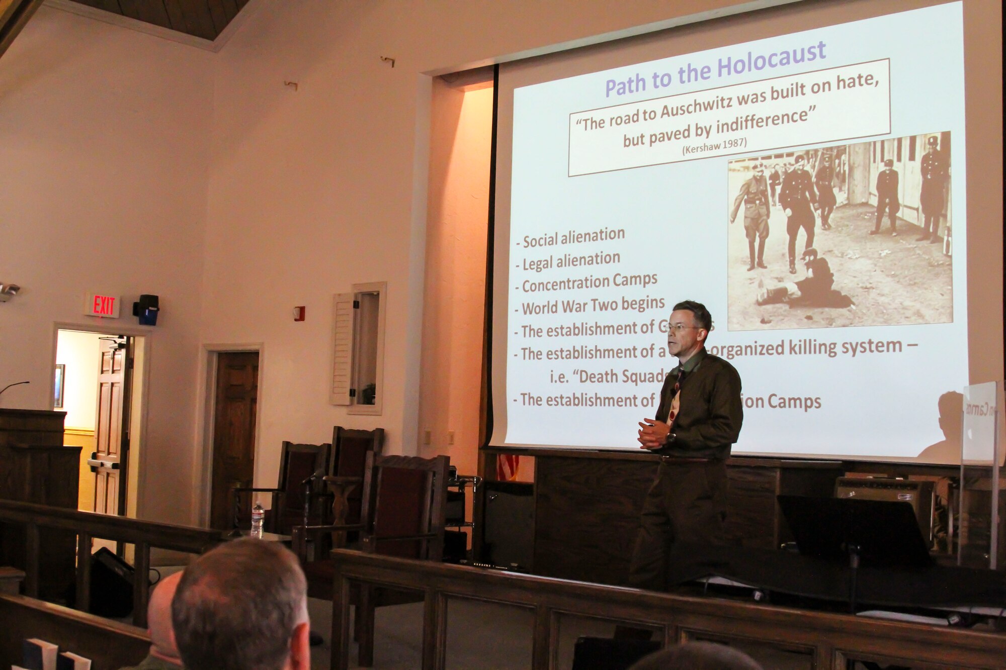 Jeffrey Mcgovern, 12th Air Force (Air Forces Southern) Historian, speaks about the actions that lead to the Holocaust during a Holocaust Day of Remembrance event on Davis-Monthan AFB, Ariz., May 2, 2014.  The event was hosted by the 12th Air Force (Air Forces Southern) Holocaust Remembrance Committee as part of the nation’s annual commemoration of the Holocaust. (U.S. Air Force photo by Tech. Sgt. Heather R. Redman/Released)