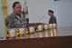 U.S. Air Force Master Sgt. Elizabeth Staub, 27th Special Operations Logistics Readiness Squadron first sergeant, lights a candle during a Holocaust Remembrance ceremony at the Cannon Chapel April 28, 2014, at Cannon Air Force Base, N.M. The remembrance ceremony was held to honor those who lost their lives as a result of the Holocaust. (U.S. Air Force photo/Senior Airman Xavier Lockley)