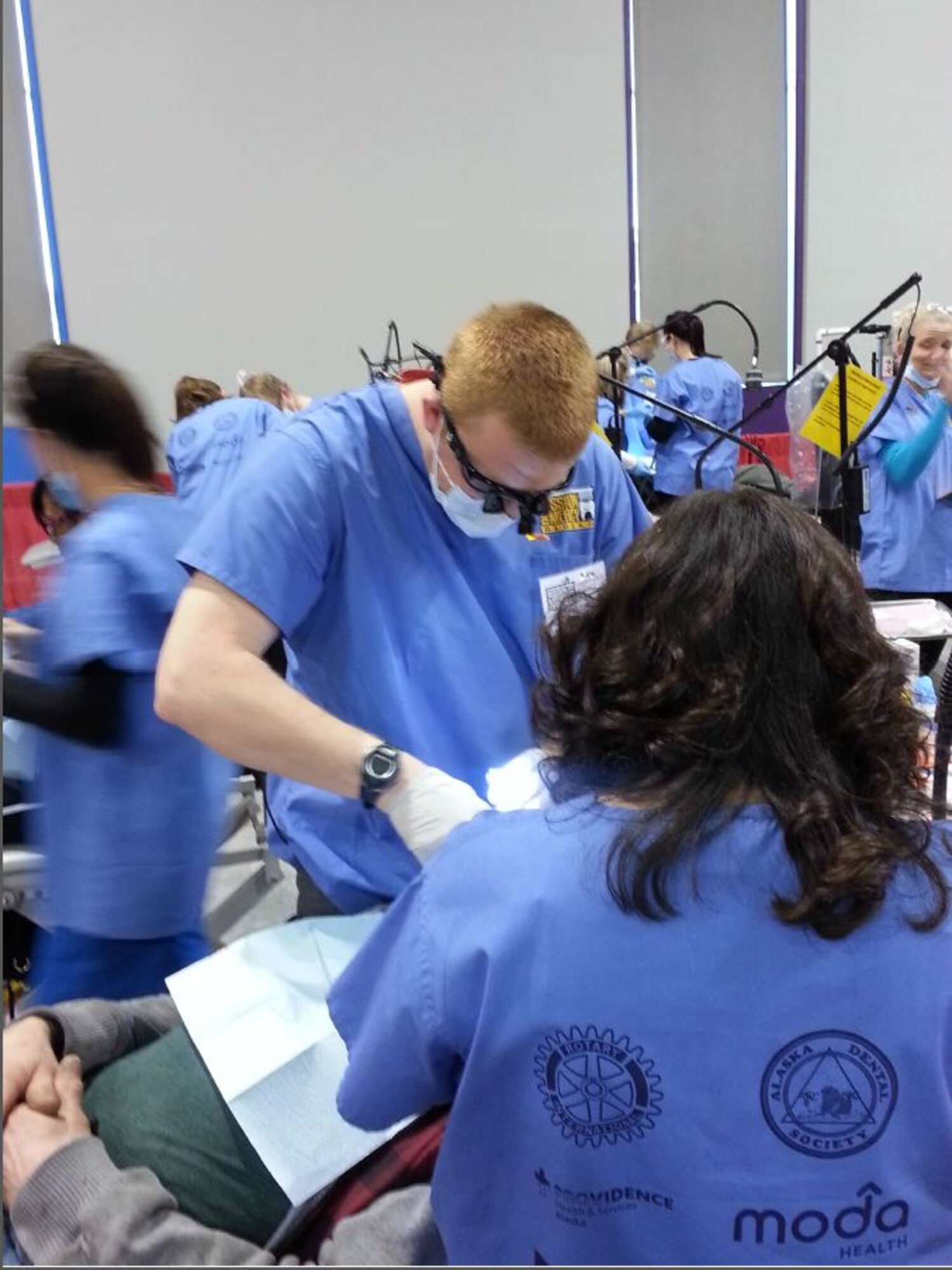 Capt. Daniel Binkowski, 354th Medical Operations Squadron dentist, preforms oral surgery on a patient during Mission of Mercy Alaska. (Courtesy Photo)