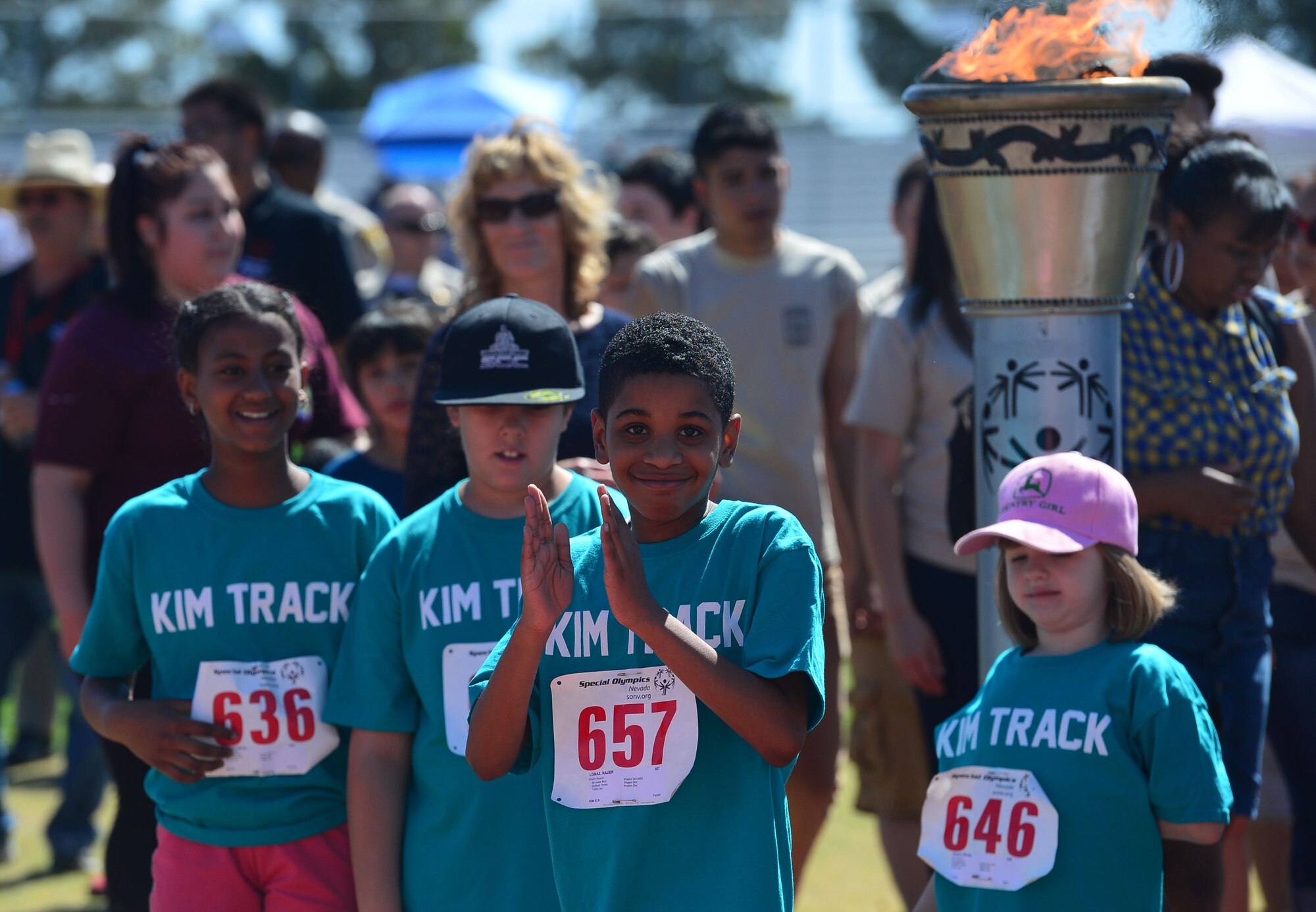 Children celebrate at the opening ceremony of the Nevada Special Olympics at Cheyenne High School in Las Vegas May 1, 2014. Throughout the two-day event, athletes participated in track and field events geared to help adults and children with disabilities gain the confidence need to be successful.