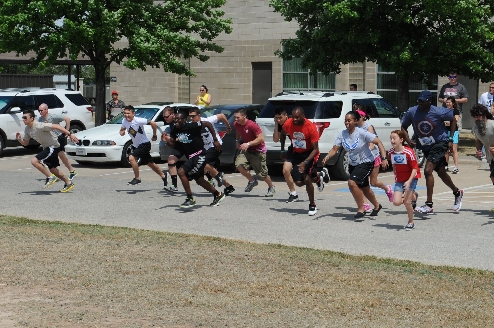 GOODFELLOW AIR FORCE BASE, Texas -- Participants at the 4th Annual Sexual Assault and Response Coordinator Challenge race to the first of 15 stations scattered throughout the base here April 26. Each station required teams to complete tasks to receive facts about Sexual Assault Awareness as well as clues to the location of the next challenge. (U.S. Air Force photo/ Staff Sgt. Laura R. McFarlane)