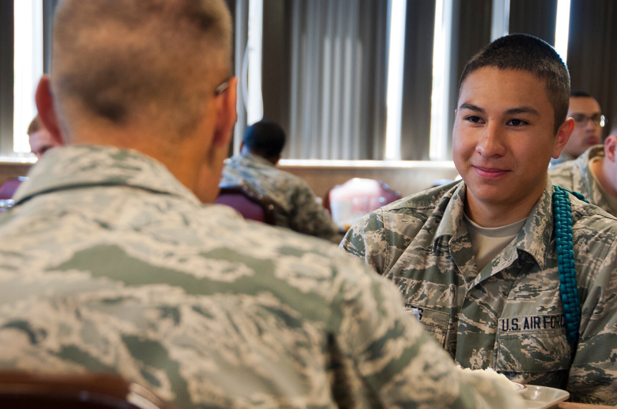 Airman Miguel Aviles, 364th Training Squadron electrical and environmental student, eats lunch with other students from his squadron May 2, 2014, at Sheppard Air Force Base, Texas. Aviles wears a real rope on his left shoulder signifying he is a member of students against sexual assault and harassment. The SASH program is a visible reminder of the fight across America to eradicate sexual assault in the Air Force, Department of Defense and our nation. (U.S. Air Force photo/Airman 1st Class Robert L. McIlrath)