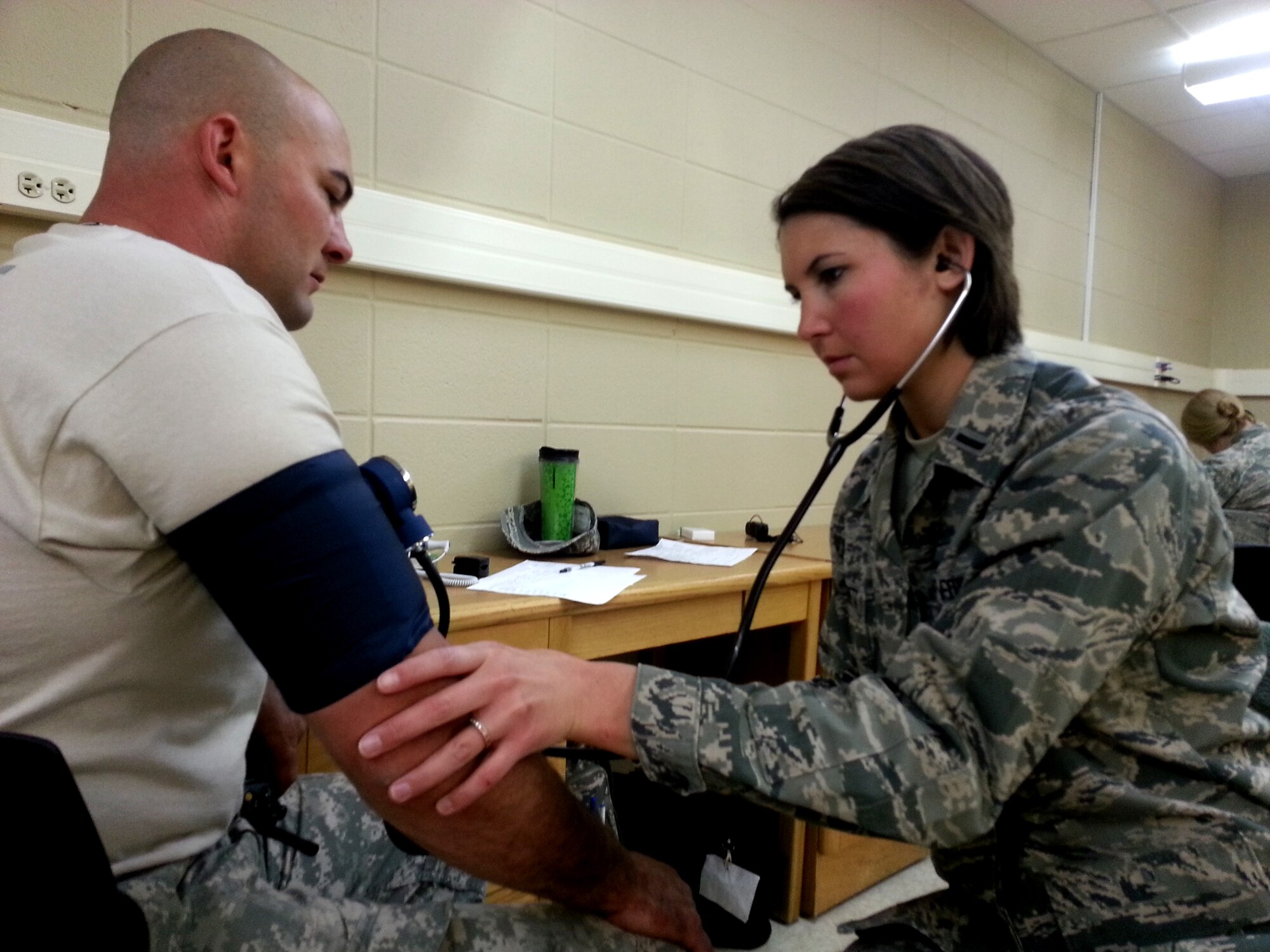 1st Lt. Kelli Marietta with the 181st Intelligence Wing CERF-P, or Chemical, Biological, Nuclear, Radiological and high-yield Explosive Enhanced Response Force Package, performs a vitals check on a CERF-P member from the 81st Troop Command before a training exercise Thursday, April 16, at Muscatatuk Urban Training Center in Butlerville, Ind. The 19th CERF-P is a joint Air and Army National Guard team comprised of the 181st Intelligence Wing's CERF-P medics and the 81st Troop Command's emergency response unit. The training prepares the 19th CERF-P for rapid response to natural and man-made disasters throughout the state of Indiana. (U.S. Air National Guard photo by Airman 1st Class Joe Boals/Released)