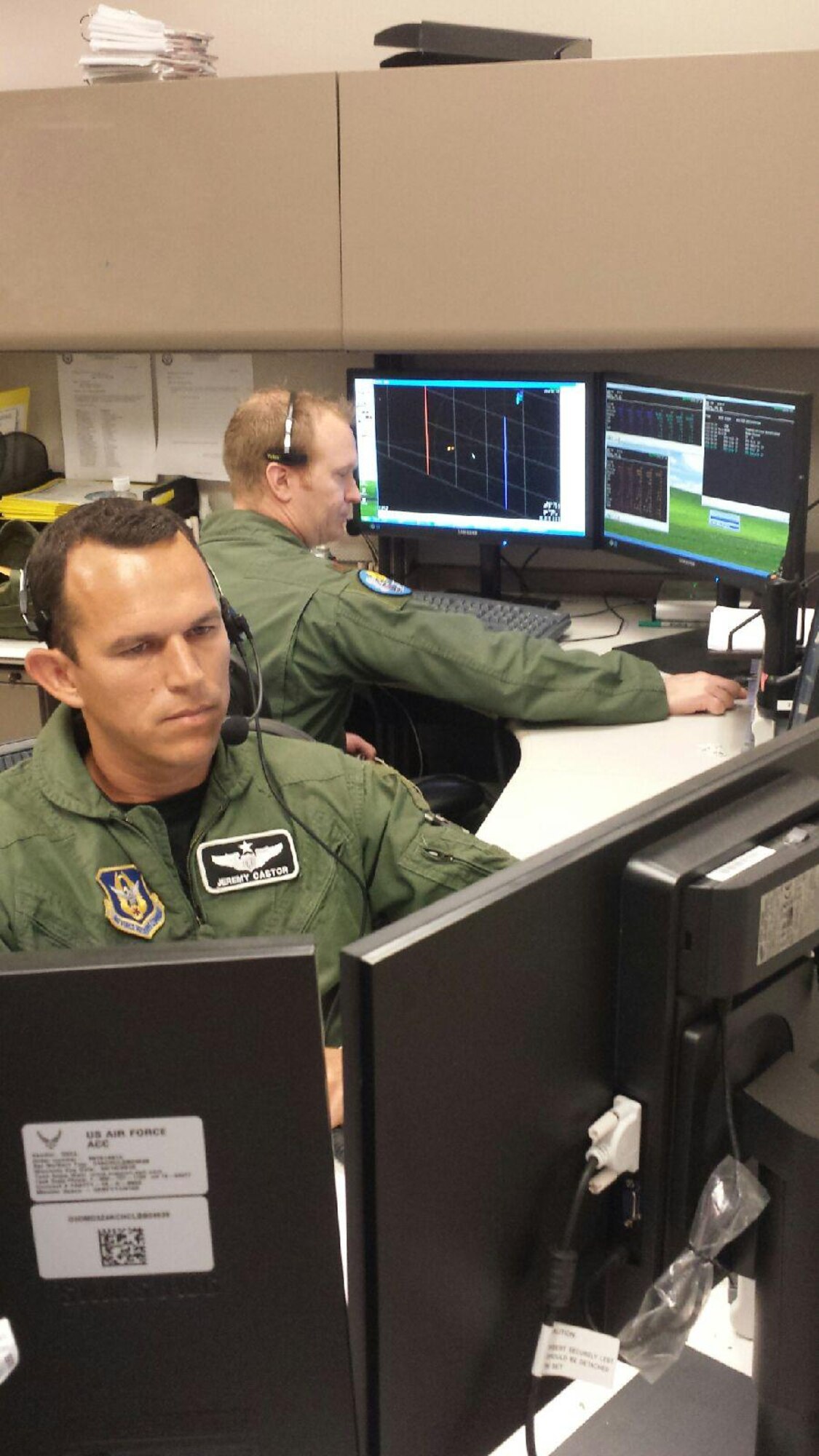 F-16 pilot Maj. Jeremy Castor and F-15 pilot Maj. Mike Douglas, both of the 85th Test Evaluation Squadron, serve as tactical controllers for air-to-air combat training missions at Eglin AFB today, which included F-16 pilots from the 419th Fighter Wing and 40th Test Squadron as well as F-15 and F-16 pilots from the 85th TES. The integrated training operations gave the pilots a chance to train together as though they were in a real-world combat scenario. Reserve 419th pilots and maintenance personnel from Hill AFB have been here for the past two weeks training alongside the 85th TES. (U.S. Air Force photo/Kari Tilton)