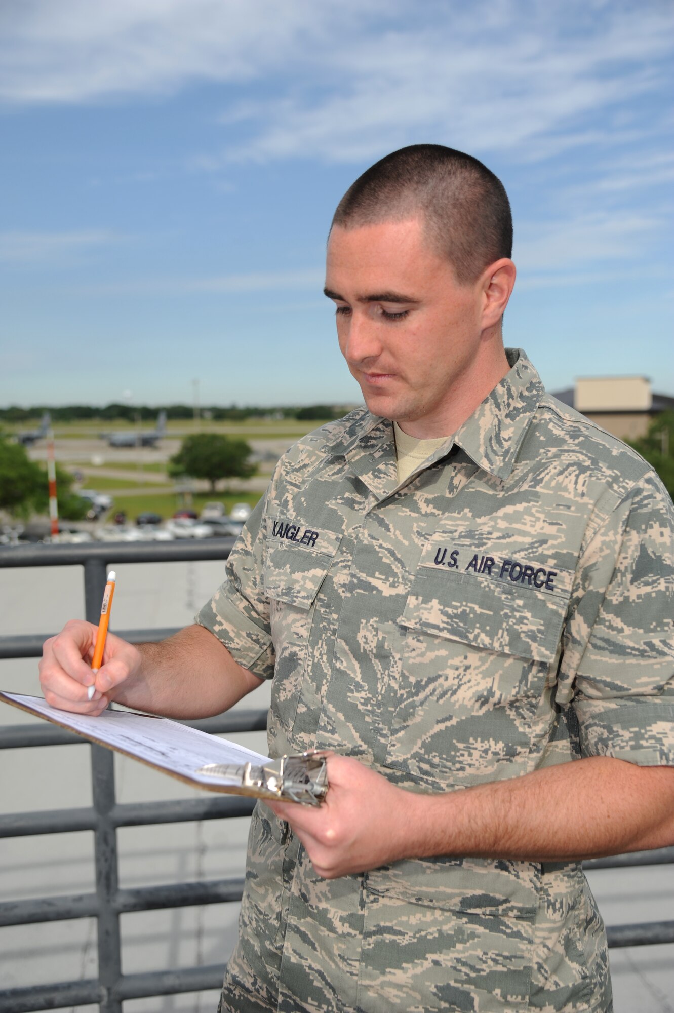 Airman John Kaigler, 335th Training Squadron, records data during a weather observation on the observatory tower of the weather training complex during the weather apprentice course May 1, 2014, at Keesler Air Force Base, Miss.  Kaigler, a reservist from Lexington, S.C., graduated with perfect scores and will report to the 5th Operational Weather Flight, Shaw Air Force Base, S.C.  (U.S. Air Force photo by Kemberly Groue)