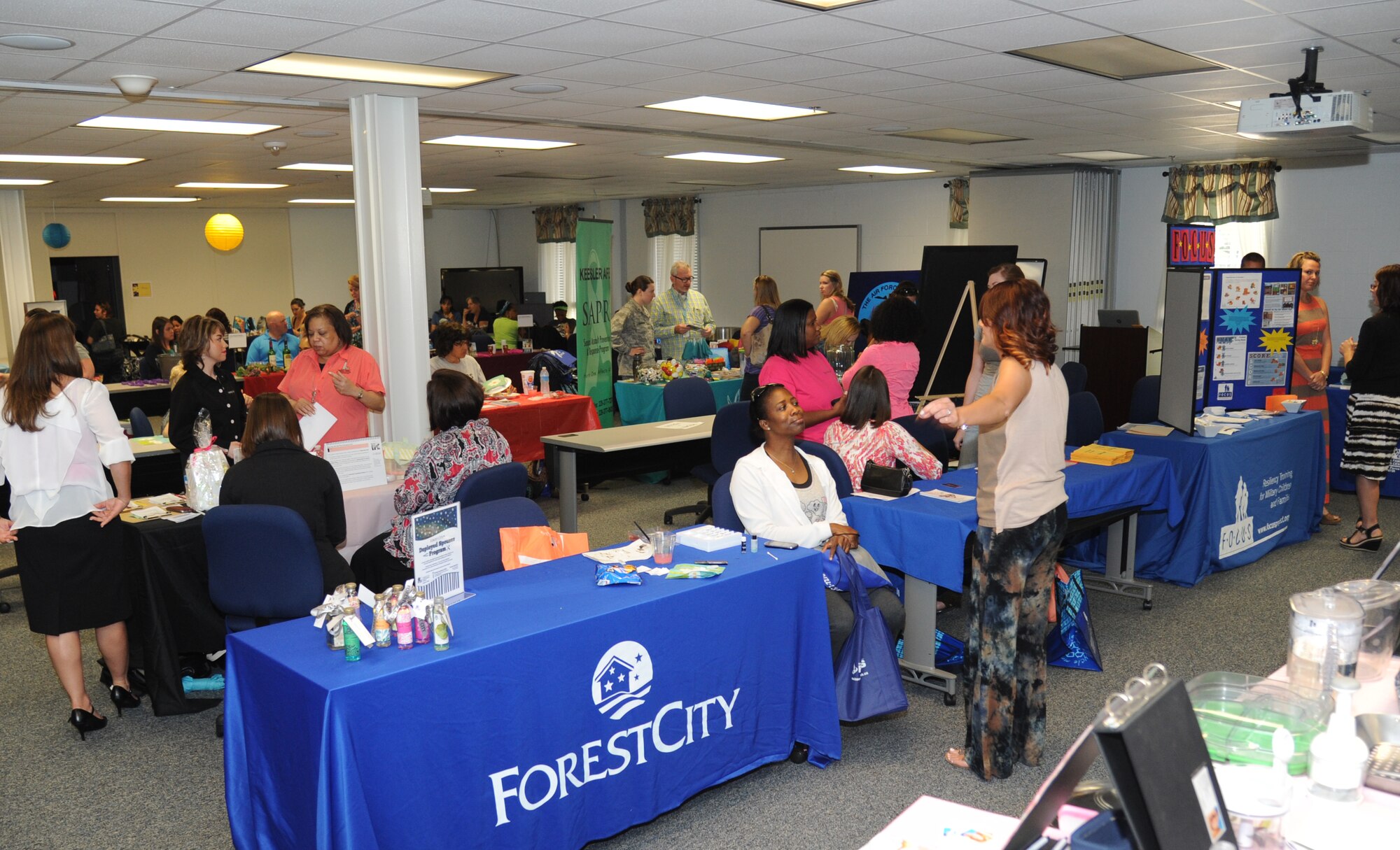 Spouses view informational awareness and business booths during Pamper Me Day for military spouses May 1, 2014, at the Sablich Center, Keesler Air Force Base, Miss.  Keesler’s Airman & Family Readiness Center has hosted the event for the past 10 years, offering spouses free manicures, hair styling, makeup and massages.  (U.S. Air Force photo by Kemberly Groue)