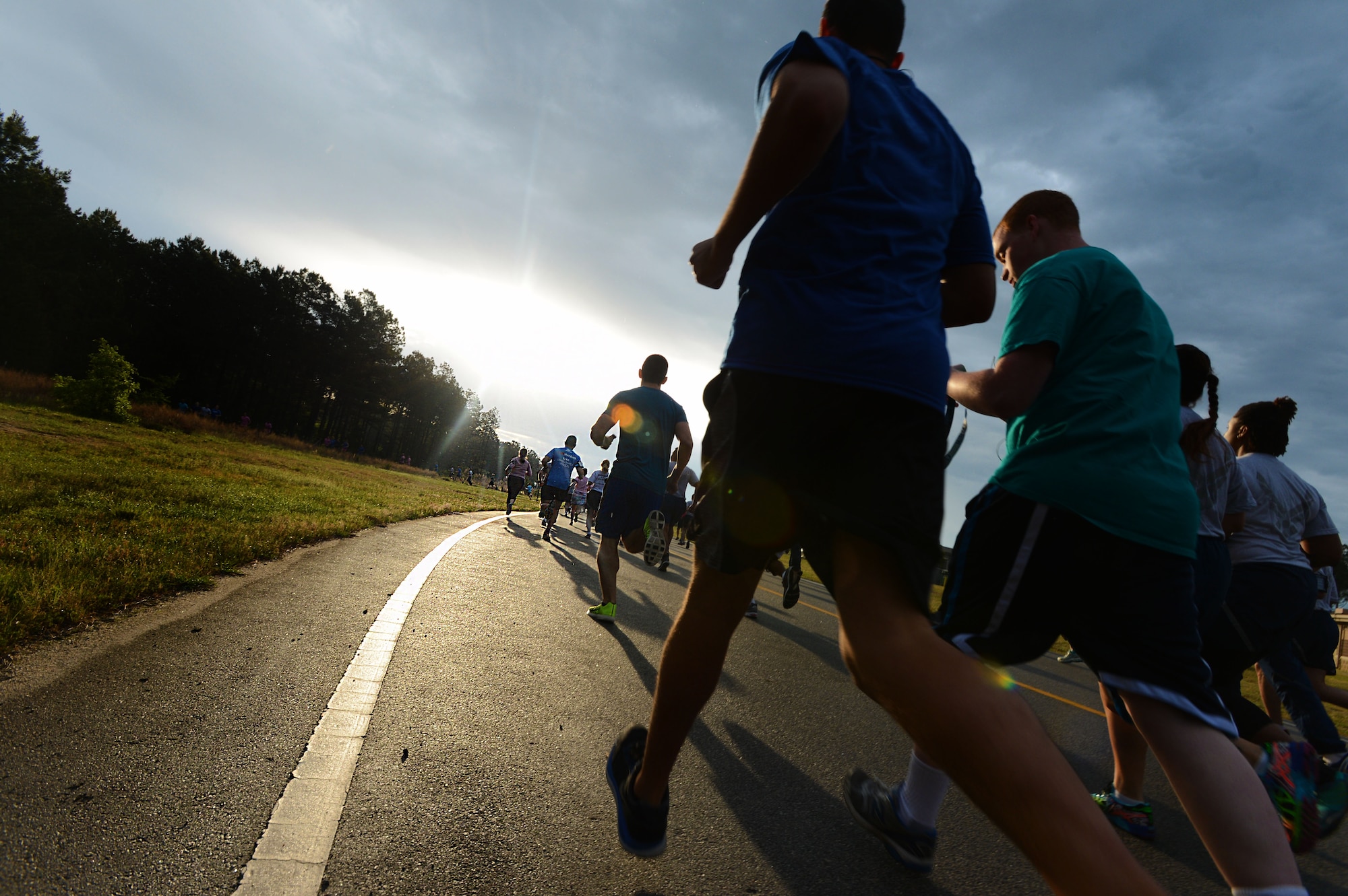 Team Shaw members run a 5K Sexual Assault Prevention and Response run at Shaw Air Force Base, S.C., May 2, 2014. More than 800 people participated in the run to help raise awareness and collect donations for victims of sexual assault and sexual harassment. (U.S. Air Force photo by Airman 1st Class Jensen Stidham/Released) 
