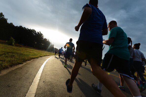 Team Shaw members run a 5K Sexual Assault Prevention and Response run at Shaw Air Force Base, S.C., May 2, 2014. More than 800 people participated in the run to help raise awareness and collect donations for victims of sexual assault and sexual harassment. (U.S. Air Force photo by Airman 1st Class Jensen Stidham/Released) 
