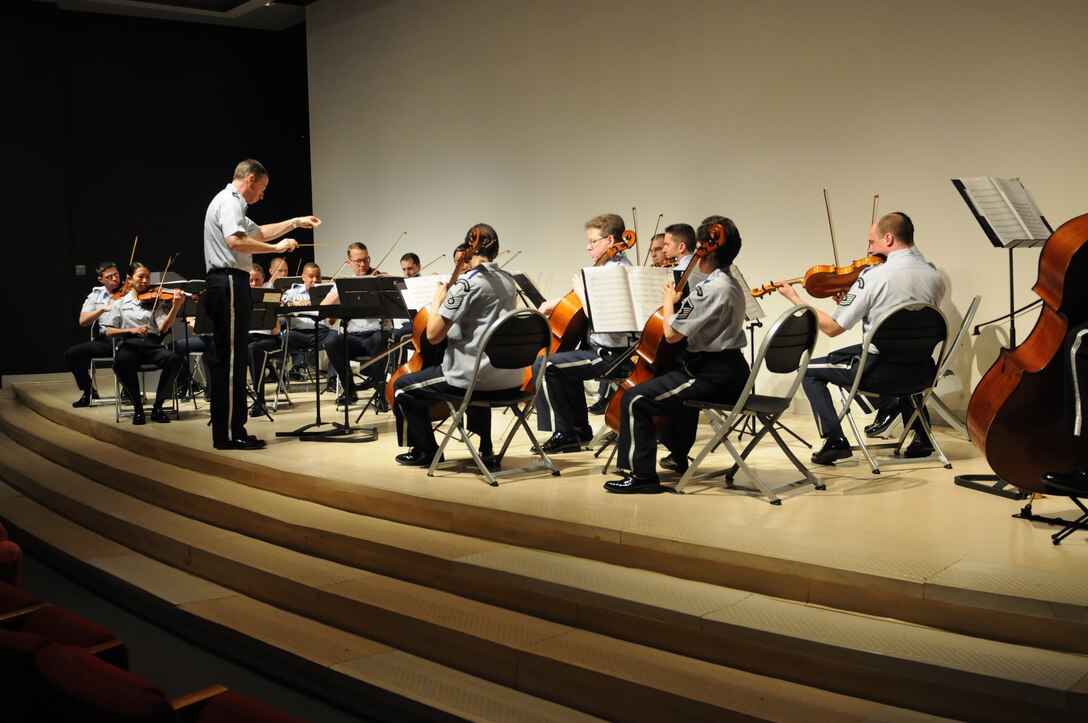 Major Michael Willen conducts the Air Force Strings at a performance April 12, 2014.  The Strings performed at Ring Auditorium, Smithsonian's Hirshhorn Museum in Washington, D.C. (Air National Guard photo by Tech. Sgt. David Eichaker/released)