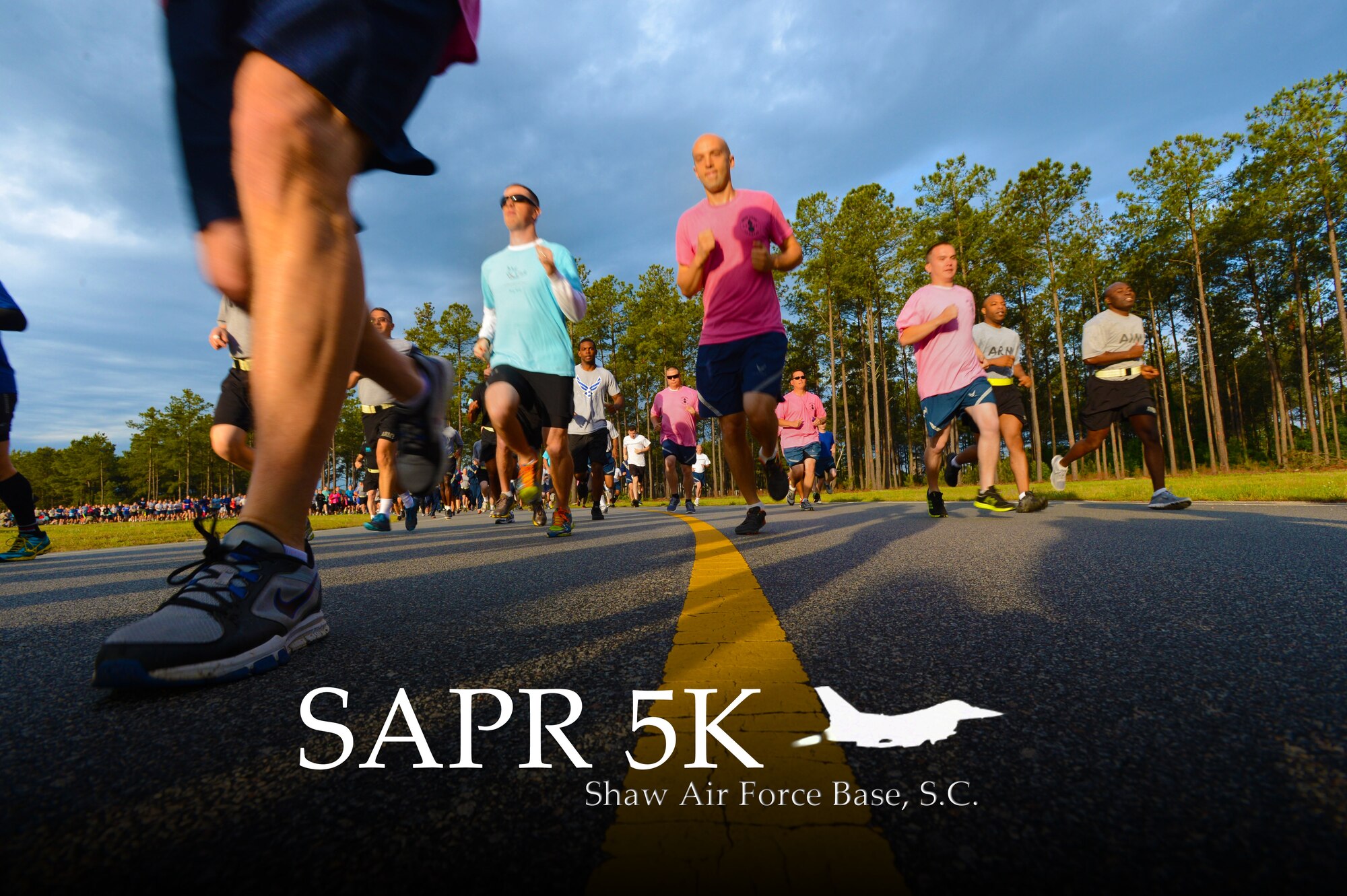 Team Shaw members run a 5K Sexual Assault Prevention and Response run at Shaw Air Force Base, S.C., May 2, 2014. More than 800 people participated in the run to help raise awareness and collect donations for victims of sexual assault and sexual harassment. (U.S. Air Force photo illustration by Airman 1st Class Jensen Stidham/Released) 
