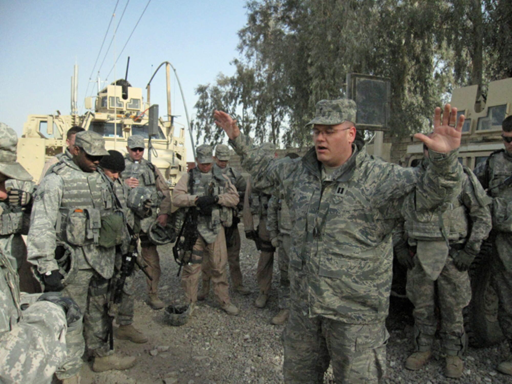 Capt. (Chaplain) David Haltom, 60th Air Mobility Wing, holds his hands up during a convoy in Iraq. Haltom will achieve "Warrior" recognition for his accomplishments in the Leadership Pathways program. (courtesy photo)