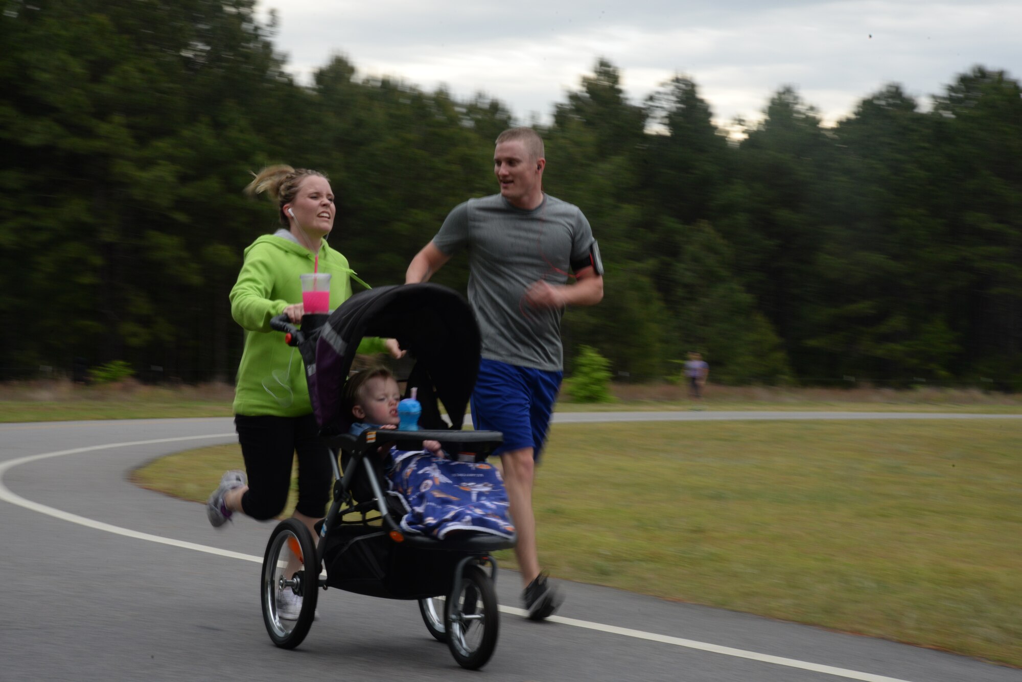 The George’s, a Team Shaw family, prepares to cross the finish line during the annual 5K Sexual Assault Prevention and Response run at Shaw Air Force Base, S.C., May 2, 2014. The run was held to help raise awareness of sexual assault and sexual harassment and collect donations for a local women’s shelter. (U.S. Air Force photo by Airman 1st Class Michael A. Cossaboom/Released)