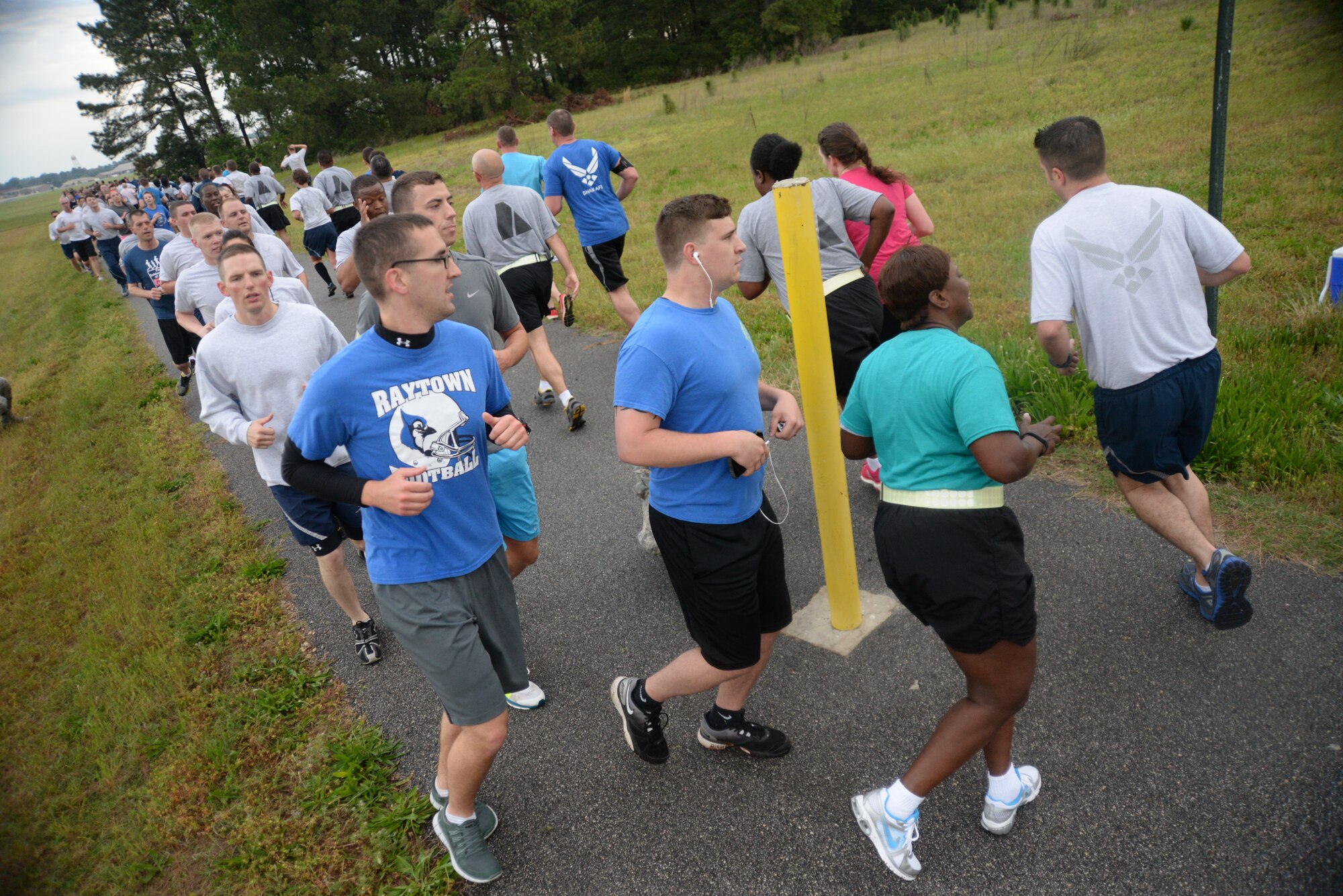 Members of Team Shaw reach the half way mark during the annual 5K Sexual Assault Prevention and Response run at Shaw Air Force Base, S.C., May 2, 2014. Awards were given to the top three males and females at the end of the race. (U.S. Air Force photo by Airman 1st Class Michael A. Cossaboom/Released)