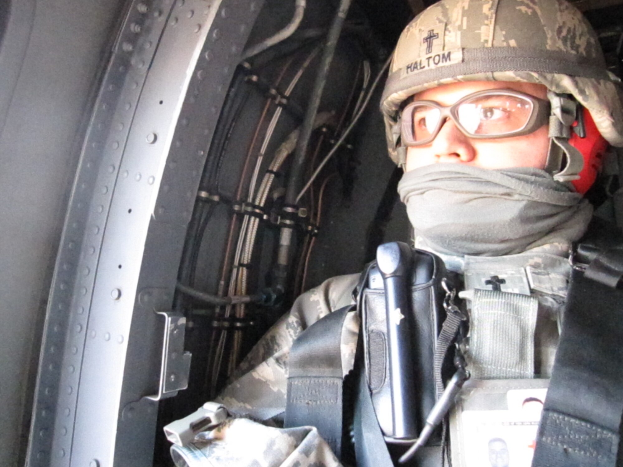 Chaplain (Capt.) David Haltom, 60th Air Mobility Wing chaplain, rides in a helicopter. The chaplain is the first in Air Mobility Command to achieve more than 30 credits in the Leadership Pathways program, which focuses on the concepts emphasized in Comprehensive Airman Fitness. (courtesy photo)