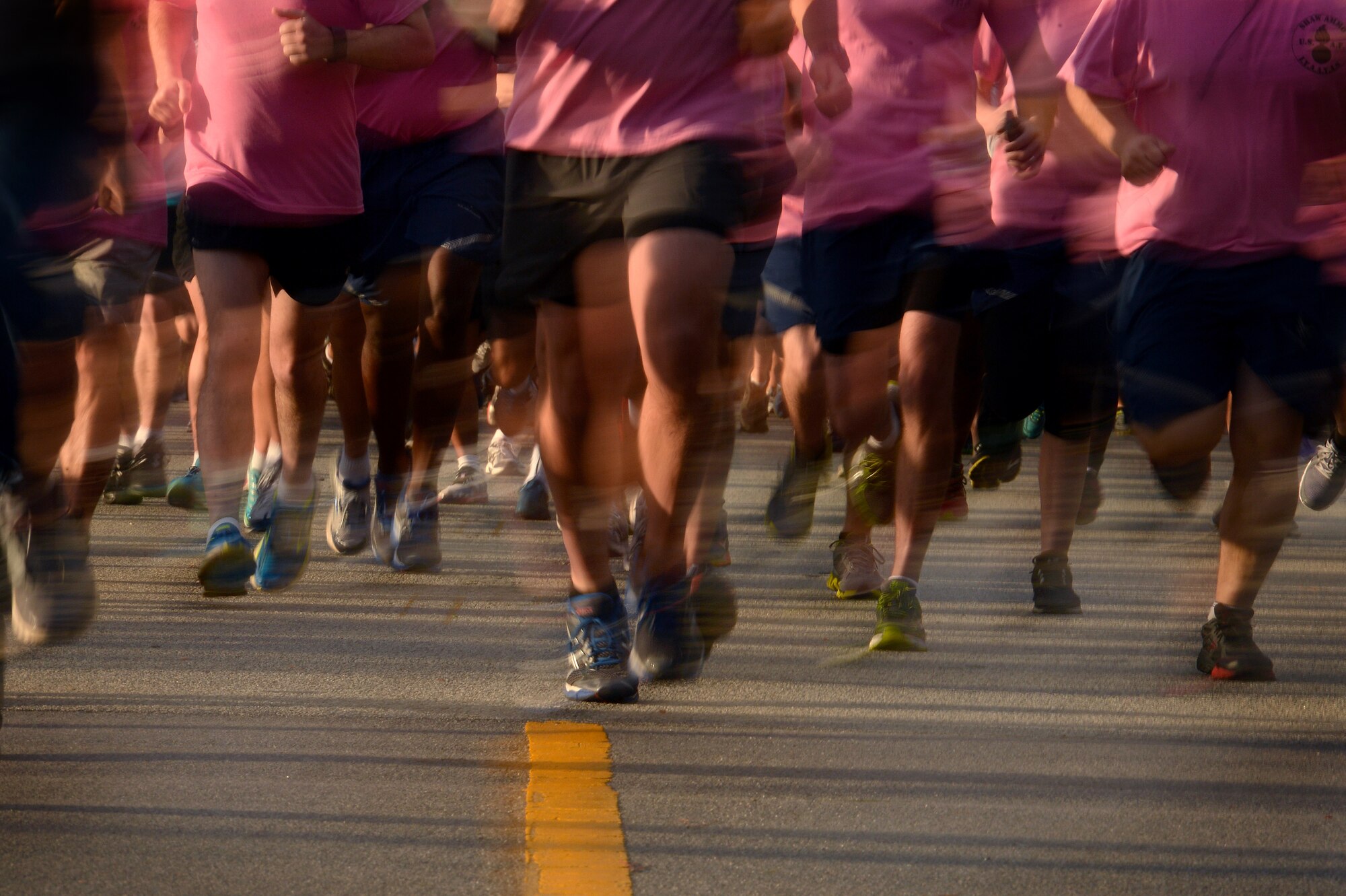 More than 500 Team Shaw members launch from the starting line at the beginning of a 5K run, May 2, 2014 at Shaw Air Force Base, S.C. The run was held to promote sexual assault prevention and awareness which is amongst the highest priorities across the Department of Defense. (U.S. Air Force photo by Staff Sgt. Kenny Holston/Released)