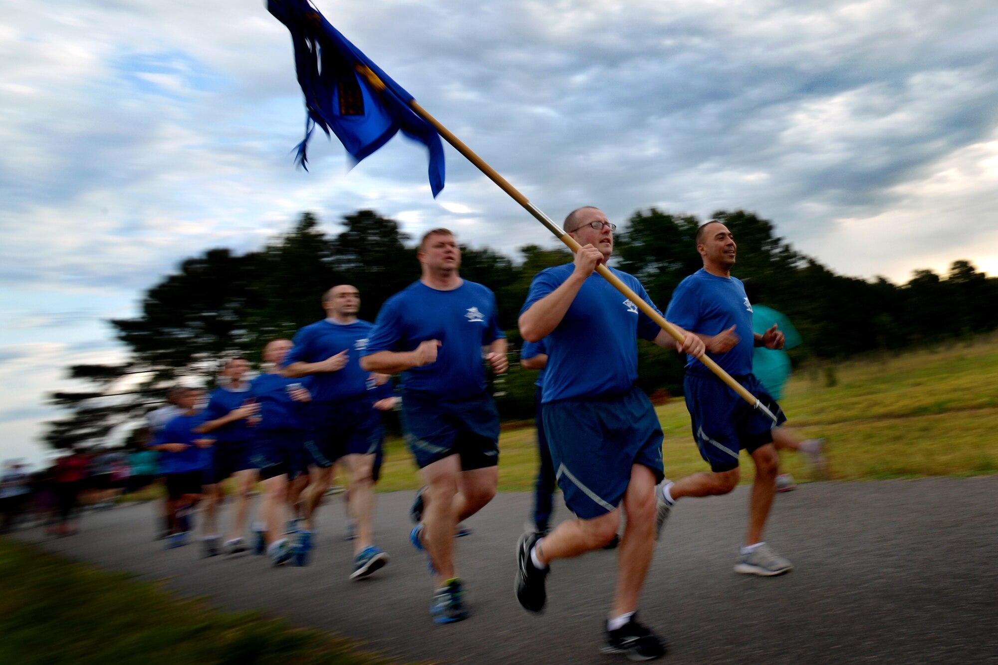 Team Shaw’s first sergeants keep a tight formation during a 5K run, May 2, 2014 at Shaw Air Force Base, S.C. Team Shaw’s Sexual Assault Prevention and Response office hosted the run which was held to spread the word about sexual assault awareness and prevention. (U.S. Air Force photo by Staff Sgt. Kenny Holston/Released)