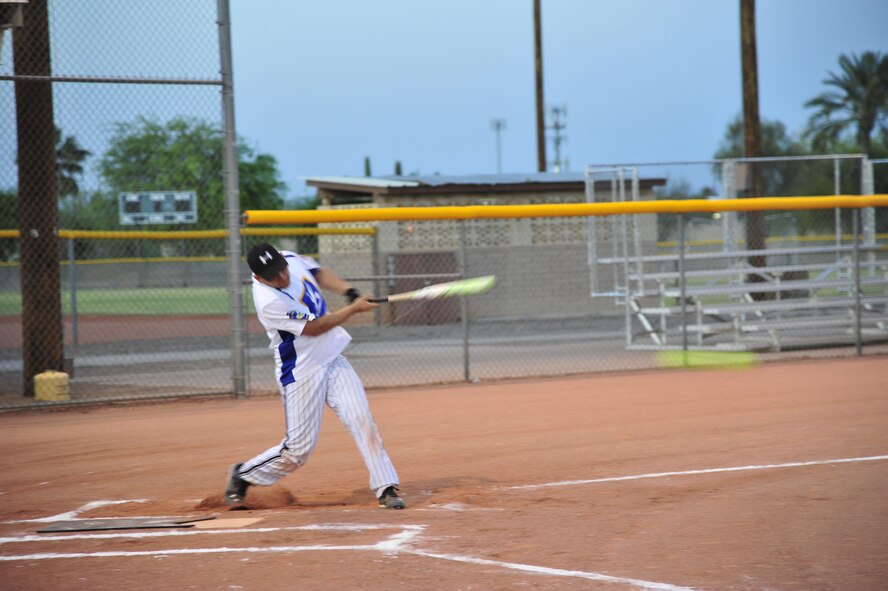 Mario Huerta, 56th Security Forces Squadron, takes a swing April 21 during a one-pitch intramural softball game against the 56th Operations Support Squadron at the Luke Air Force Base Bryant Fitness Center softball field. SFS defeated OSS 17-6. (U.S. Air Force photo/Senior Airman Grace Lee)