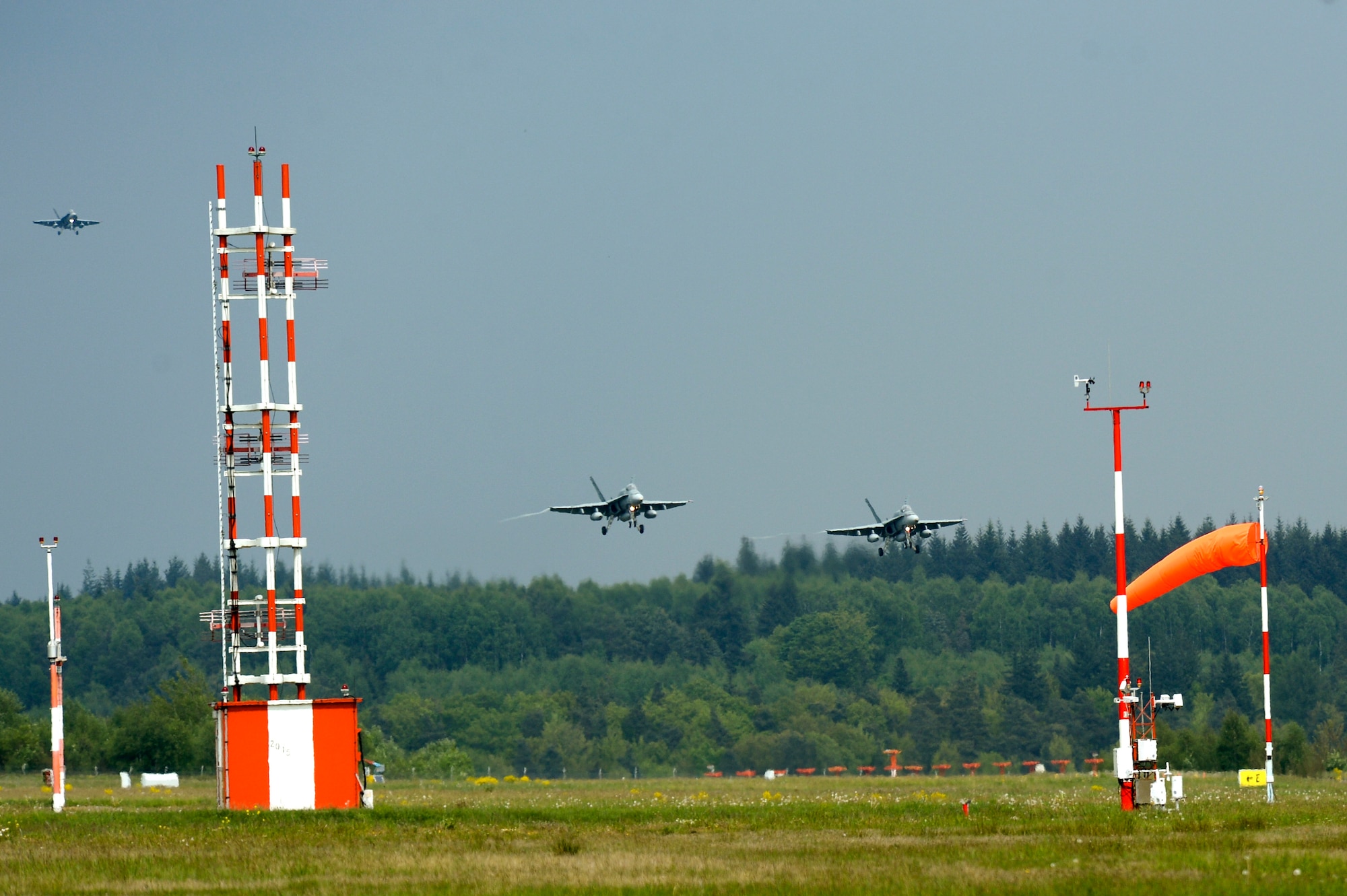 Royal Canadian Air Force CF-18 Hornet fighter aircraft pilots prepare to land on the flightline May 1, 2014, at Spangdahlem Air Base, Germany. The fighters came from the 425th Tactical Fighter Squadron based out of the RCAF’s 3rd Wing in Bagotville, Québec, as a part of NATO reassurance measures to Central and Eastern Europe. (U.S. Air Force photo by Senior Airman Rusty Frank/Released)