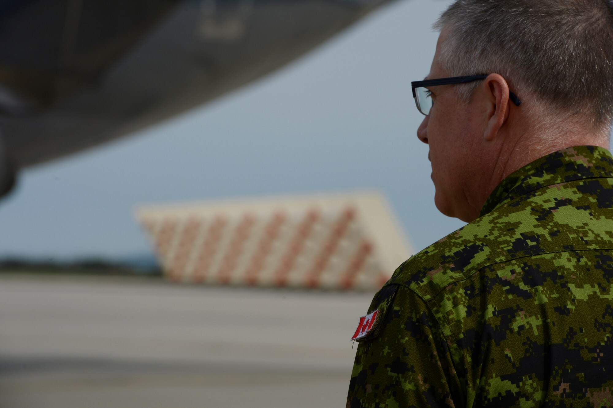 A Royal Canadian Air Force service member arrives on Spangdahlem Air Base, Germany, May 1, 2014. The Canadian Armed Forces will join Romania and other NATO allies currently operating in the region as the alliance’s part of reassurance measures to Eastern and Central Europe.  (U.S. Air Force photo by Staff Sgt. Christopher Ruano/Released)
