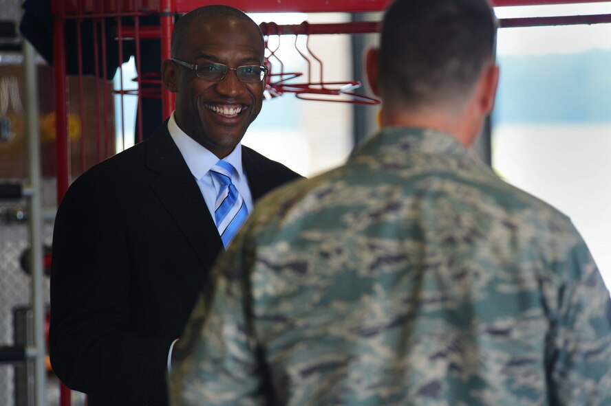 U.S. Marine Corps retired Capt. Ken Bevel speaks to an Airman at the 20th Civil Engineer Squadron Fire Department at Shaw Air Force Base, S.C., May 1, 2014. Bevel, now a feature film actor, spoke with Airmen about their military goals, importance of education and thanked them for their service. (U.S. Air Force photo by Airman 1st Class Jensen Stidham/Released)