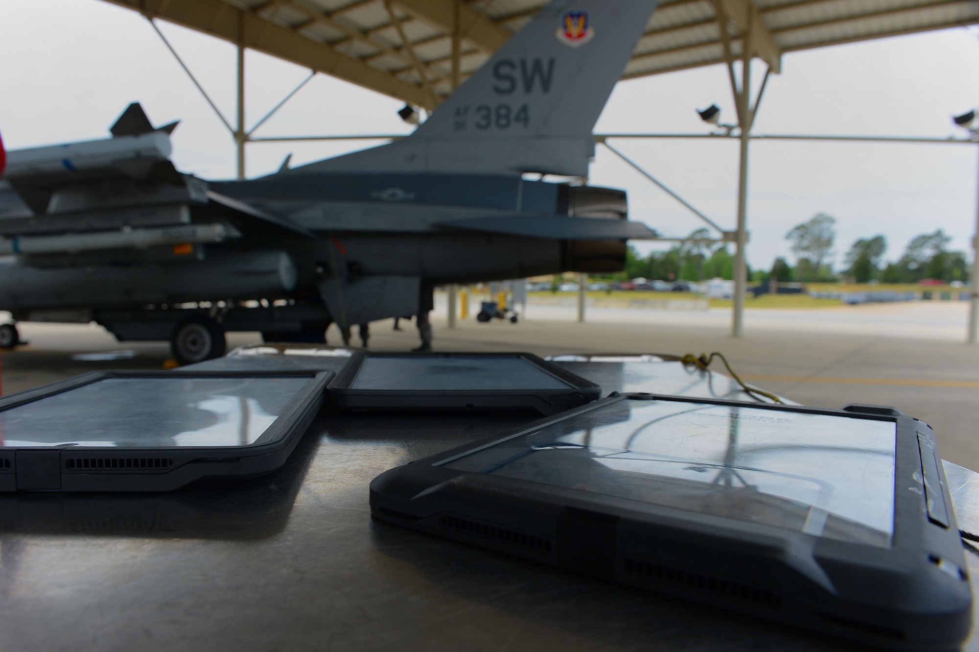 iPad versions of technical order manuals sit on a toolbox next to an F-16CJ Fighting Falcon at Shaw Air Force Base, S.C., April 29, 2014. Maintainers assigned to the 20th Aircraft Maintenance Squadron, 55th Aircraft Maintenance Unit were selected to test the durability and user capabilities of the new platform in comparison to older versions of the technical order manuals. (U.S. Air Force photo by Airman 1st Class Jensen Stidham/Released)