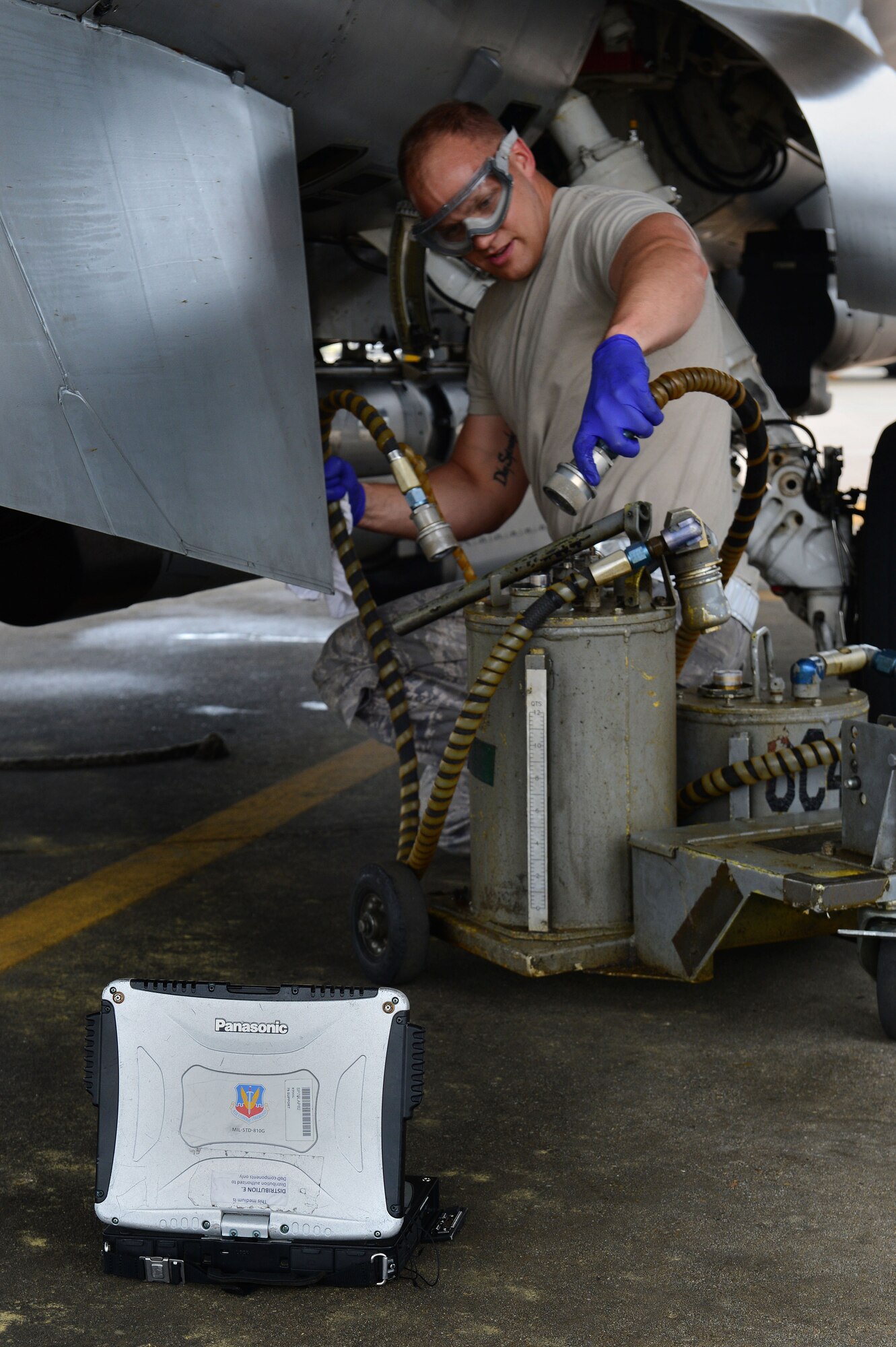 U.S. Air Force Senior Airman Kam Glowacki, 20th Aircraft Maintenance Unit 79th Aircraft Maintenance Squadron tactical aircraft maintainer, uses a technical order manual to perform maintenance on an F-16CJ Fighting Falcon at Shaw Air Force Base, S.C., April 29, 2014. Glowacki used a technical order manual during post flight inspections while the 55th AMU tested out new iPad versions of the manual. (U.S. Air Force photo by Airman 1st Class Jensen Stidham/Released)