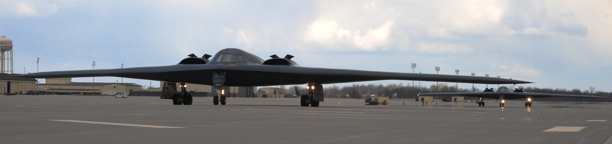 Two B-2 Spirits taxi, April 8, 2014, at Whiteman Air Force Base, Mo. The B-2 is a high subsonic jet, flown by two pilots. (U.S. Air Force photo by Senior Airman Bryan Crane/Released)