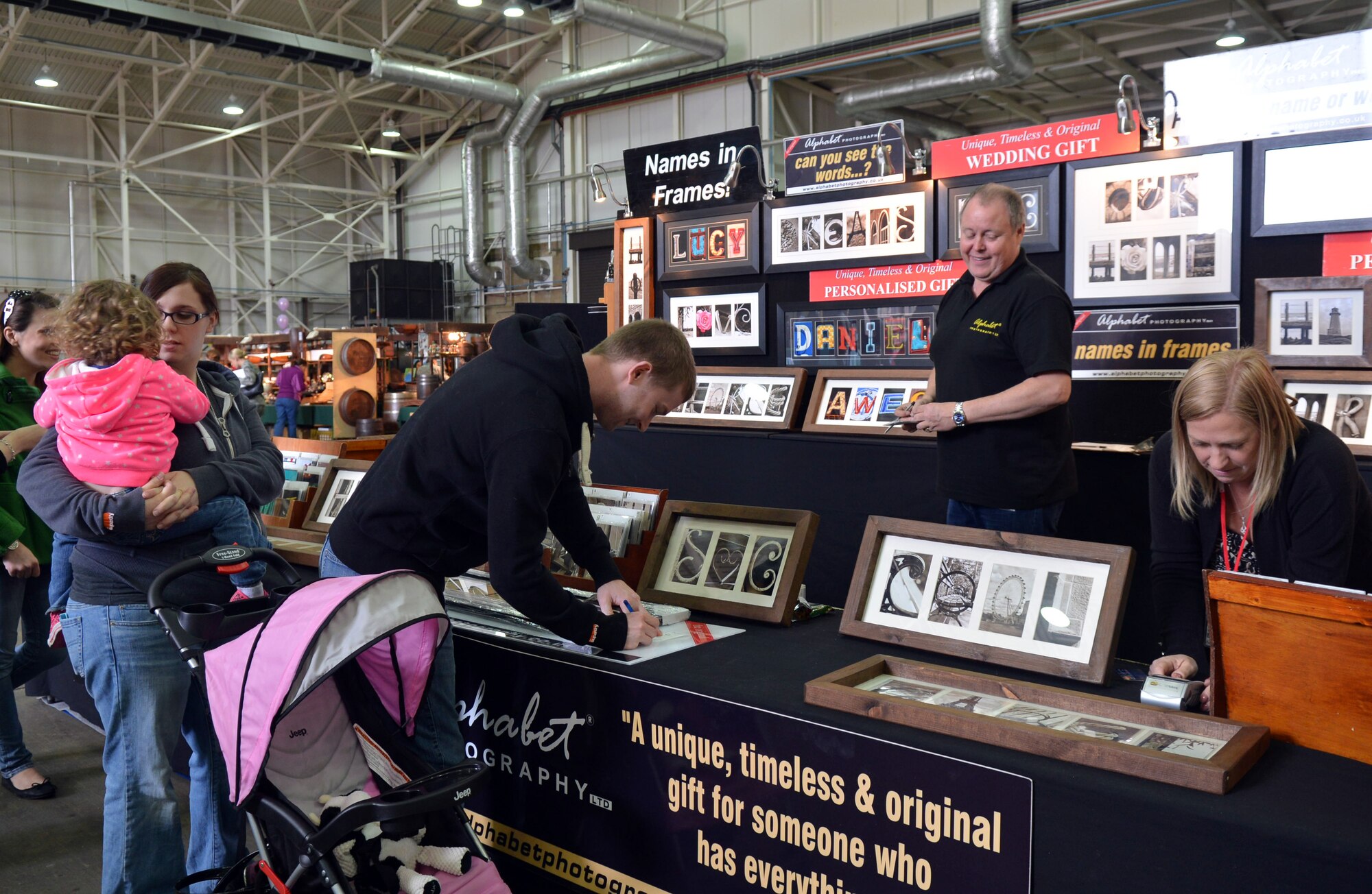 Team Mildenhall members shop at the 2014 Mayfair Bazaar May 2, 2014, on RAF Mildenhall, England. The bazaar is an annual event that attracts vendors from throughout the United Kingdom and Europe, and is open May 2 from 2 to 6 p.m., May 3 from 10 a.m. to 6 p.m. and May 4 from 10 a.m. to 3 p.m. (U.S. Air Force photo by Airman 1st Class Kyla Gifford/Released)