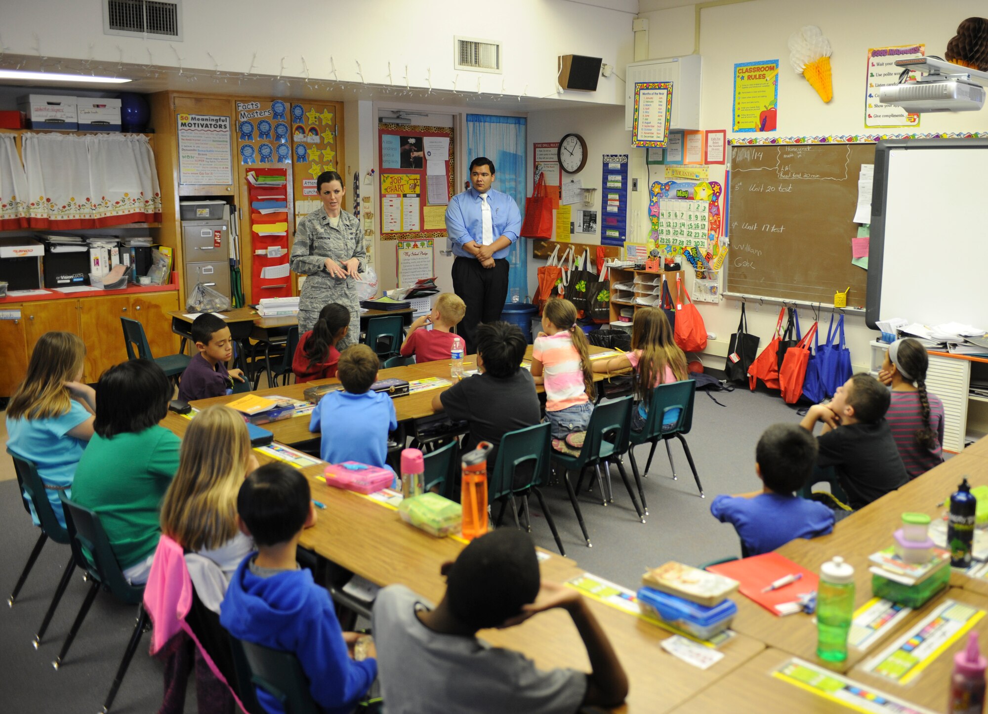 U.S. Air Force Capt. Jenny Liabenow, 355th Fighter Wing Judge Advocate chief of military justice, and Rudy Padilla, University of Arizona law student, teach the importance of voting during a Law Day visit to Borman Elementary School at Davis-Monthan Air Force Base, Ariz., May 1, 2014. The students learned that voting is the best way to get one's opinion heard. It allows them to select the candidate who best represents their views. (U.S. Air Force photo by Senior Airman Sivan Veazie/Released)