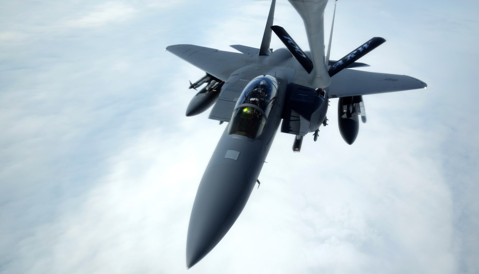 An F-15E Strike Eagle assigned to RAF Lakenheath, England, takes on fuel from a KC-135 Stratotanker assigned to RAF Mildenhall, England, during a formation flight May 1, 2014, off the coast of England. The formation flight included two F-15Es and an Italian air force KC-767. (U.S. Air Force photo by Airman 1st Class Dillon Johnston/Released)