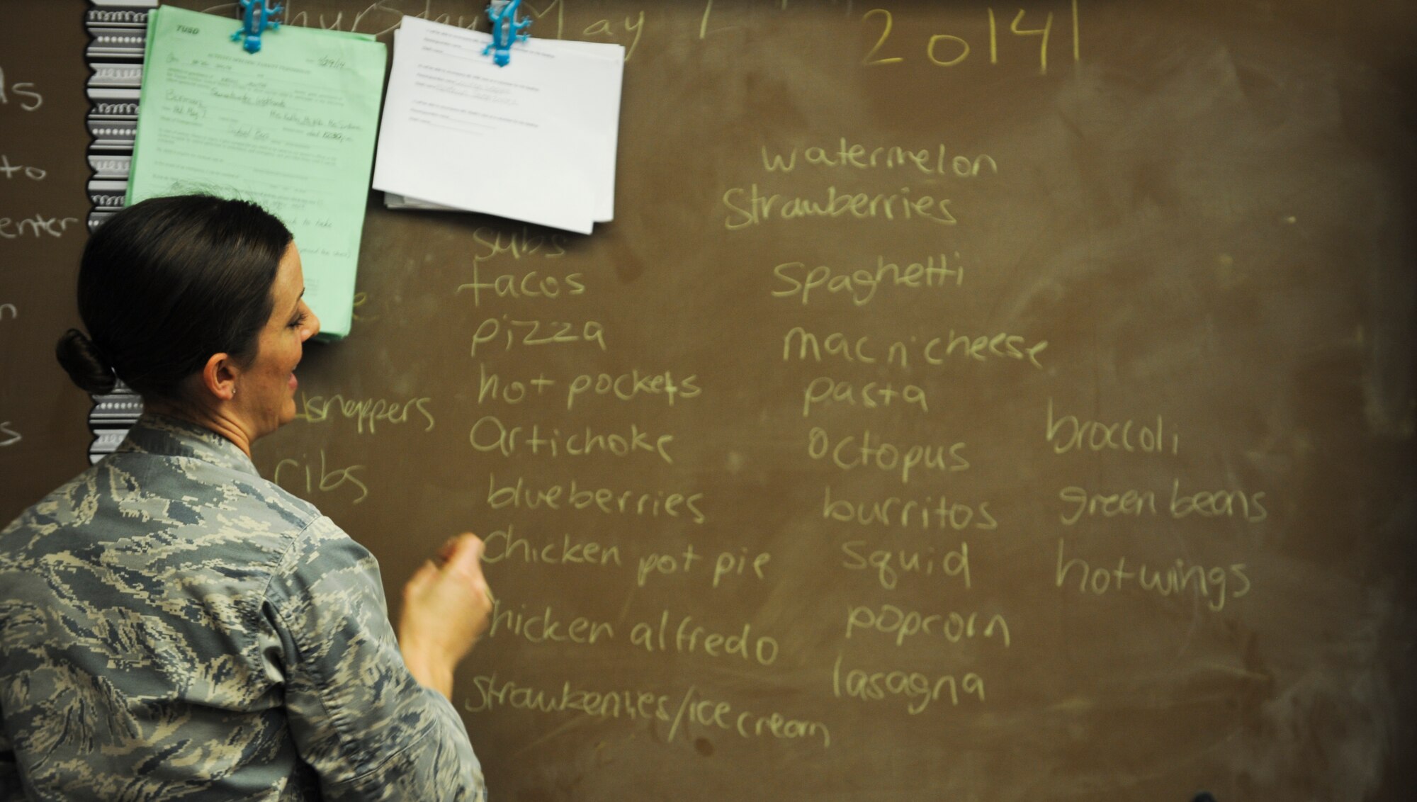 U.S. Air Force Capt. Jenny Liabenow, 355th Fighter Wing Judge Advocate chief of military justice, writes down kids’ favorite foods during a Law Day visit to Borman Elementary School at Davis-Monthan Air Force Base, Ariz., May 1, 2014. Liabenow taught more than 40 kids about the importance of a vote, the legal system and why we vote on our senior leaders. (U.S. Air Force photo by Senior Airman Sivan Veazie/Released)