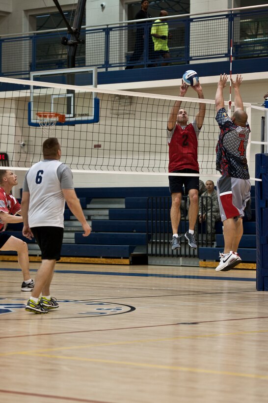 Ryan McCauley, 633rd Civil Engineer Squadron team, returns the ball during the intramural volleyball championship game at Langley Air Force Base, Va., April 29, 2014. The 633rd CES team won, defeating the 45th Intelligence Squadron team 25 to 19. (U.S. Air Force photo by Staff Sgt. Stephanie R. Plichta/Released)