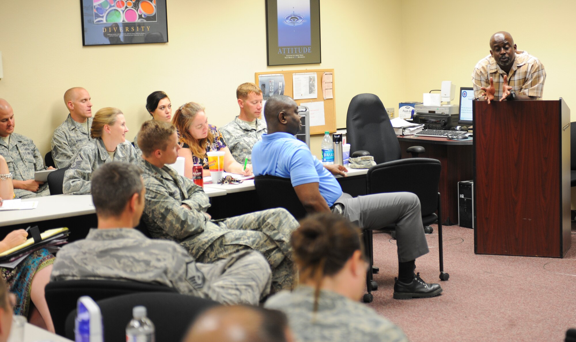Vincent Howard, Resilience Training Assistant instructor, evaluates a class during a RTA Seminar at Davis-Monthan Air Force Base, Ariz., April 30, 2014. Howard asked the class to present various forms of cognitive traps and balanced thinking to help provide solutions to everyday conflict. (U.S. Air Force photo by Senior Airman Sivan Veazie/Released)