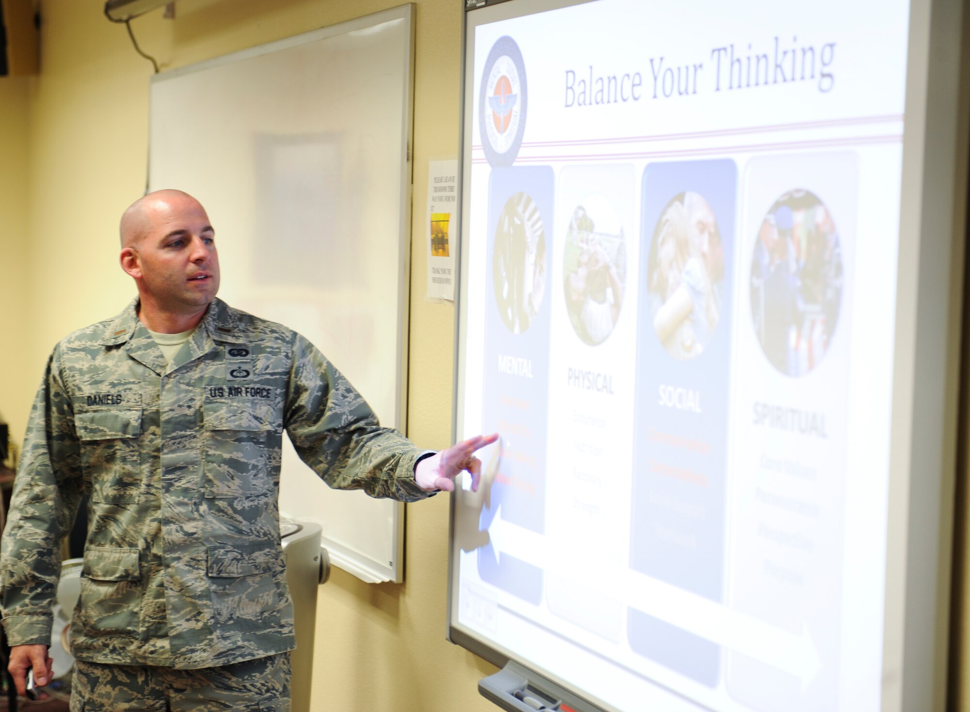 U.S. Air Force 2nd Lt. Michael Daniels, Resilience Training Assistant instructor, explains how a person should balance their thinking during a RTA Seminar at Davis-Monthan Air Force Base, Ariz., April 30, 2014. Daniels has been teaching for three years and has instructed more than 200 people on the importance of being resilient. (U.S. Air Force photo by Senior Airman Sivan Veazie/Released)