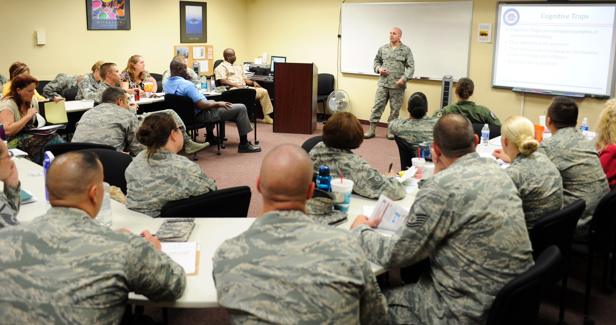 U.S. Air Force 2nd Lt. Michael Daniels, Resilience Training Assistant instructor, teaches about cognitive traps during a RTA Seminar at Davis-Monthan Air Force Base, Ariz., April 30, 2014. More than 20 Airmen and Department of Defense civilians attended the RTA Seminar to become more resilient in their way of thinking. (U.S. Air Force photo by Senior Airman Sivan Veazie/Released)