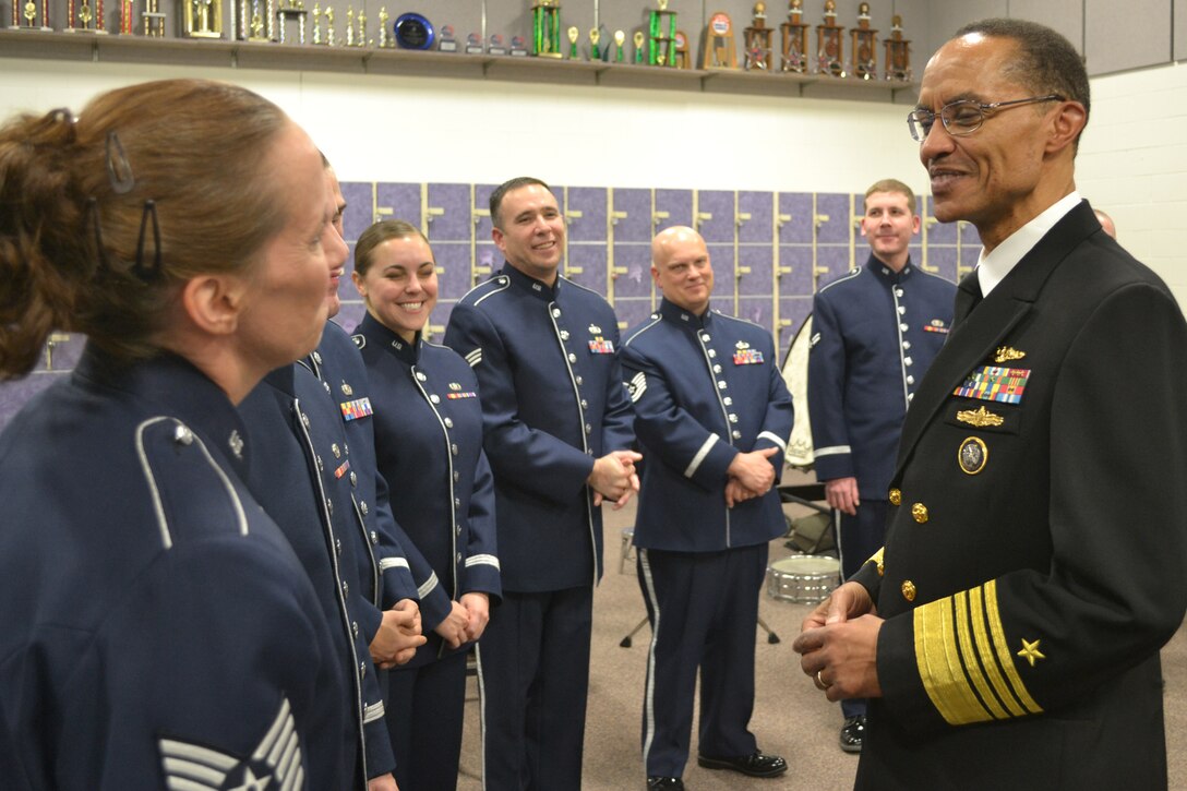 BELLEVUE, Neb. (Dec. 14, 2013) Adm. Cecil Haney, Commander, U.S. Strategic Command (USSTRATCOM), greets the members of the Heartland of America band after their performance at Bellevue East High School. The five concerts being held in the Omaha area feature senior leadership from USSTRATCOM, the 55th Wing, and the Air Force Weather Agency delivering holiday greetings and expressing their appreciation to the community (U.S. Air Force photo by Staff Sgt. Daniel Martinez/Released)