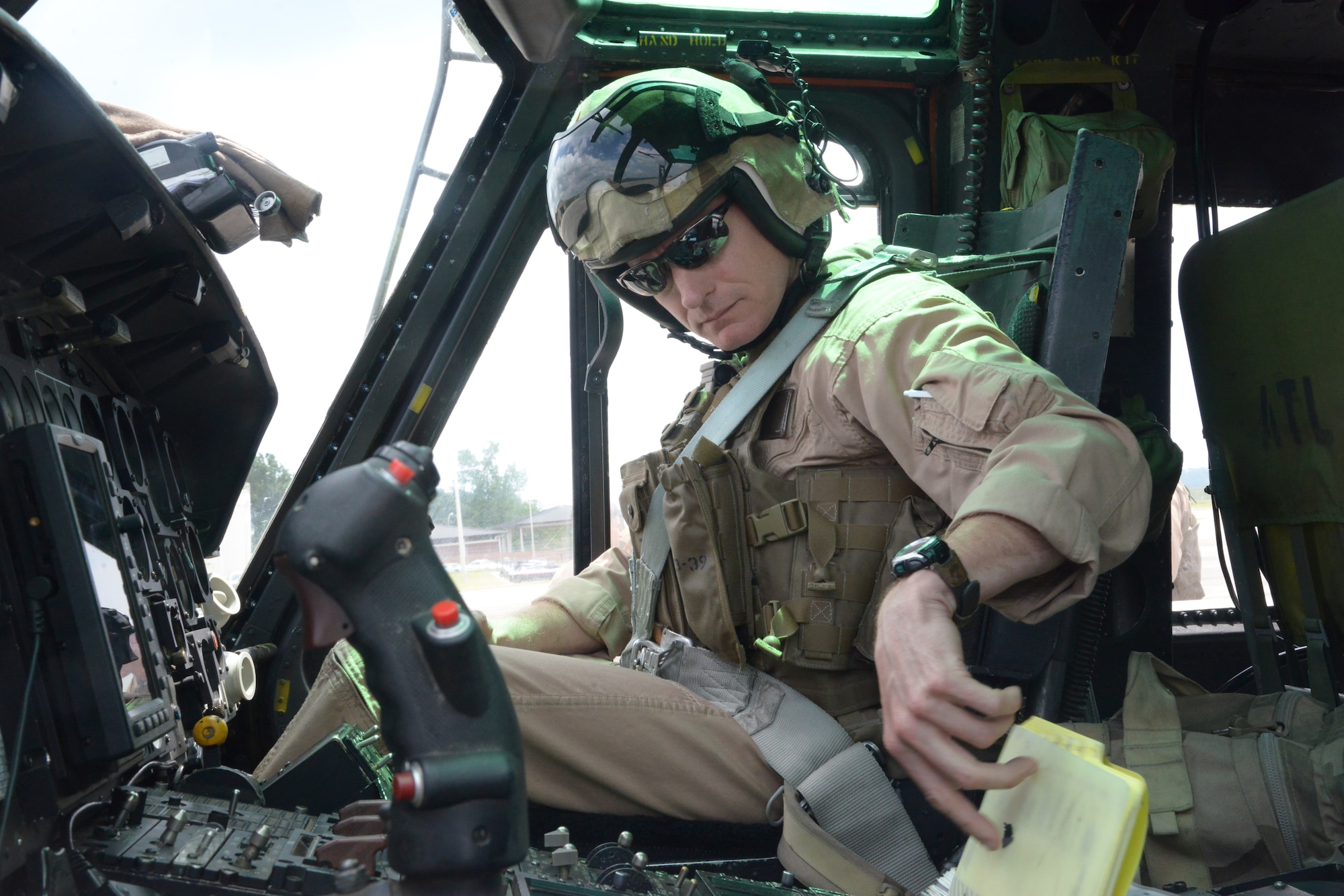 Lt. Col. Gregory Johnson, HMLA-773 pilot, completes a flight check prior to the final flight of a UH-1N Huey helicopter April 25. U.S. Air Force photo by Ray Crayton

