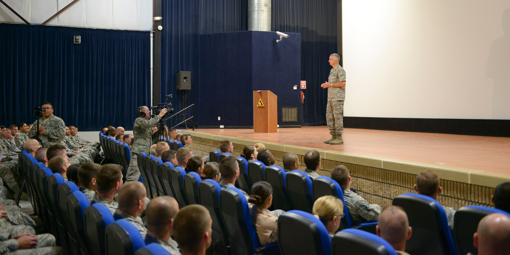 Brig. Gen. Roger H. Watkins, 379th Air Expeditionary Wing commander, speaks to the audience during the Sexual Assault Prevention and Response wing stand down day at Al Udeid Air Base, Qatar, April 29, 2014. The 379 AEW took part in an Air Force wide SAPR event, which started with a wing commander’s call. The briefing was built, developed and approved by the Chief of Staff and the SAPR office at the Pentagon. In the coming weeks each squadron will participate in small group training sessions due  to the high operations tempo in support of Operation Enduring Freedom. (U.S. Air Force photo/Senior Airman Colin Cates)