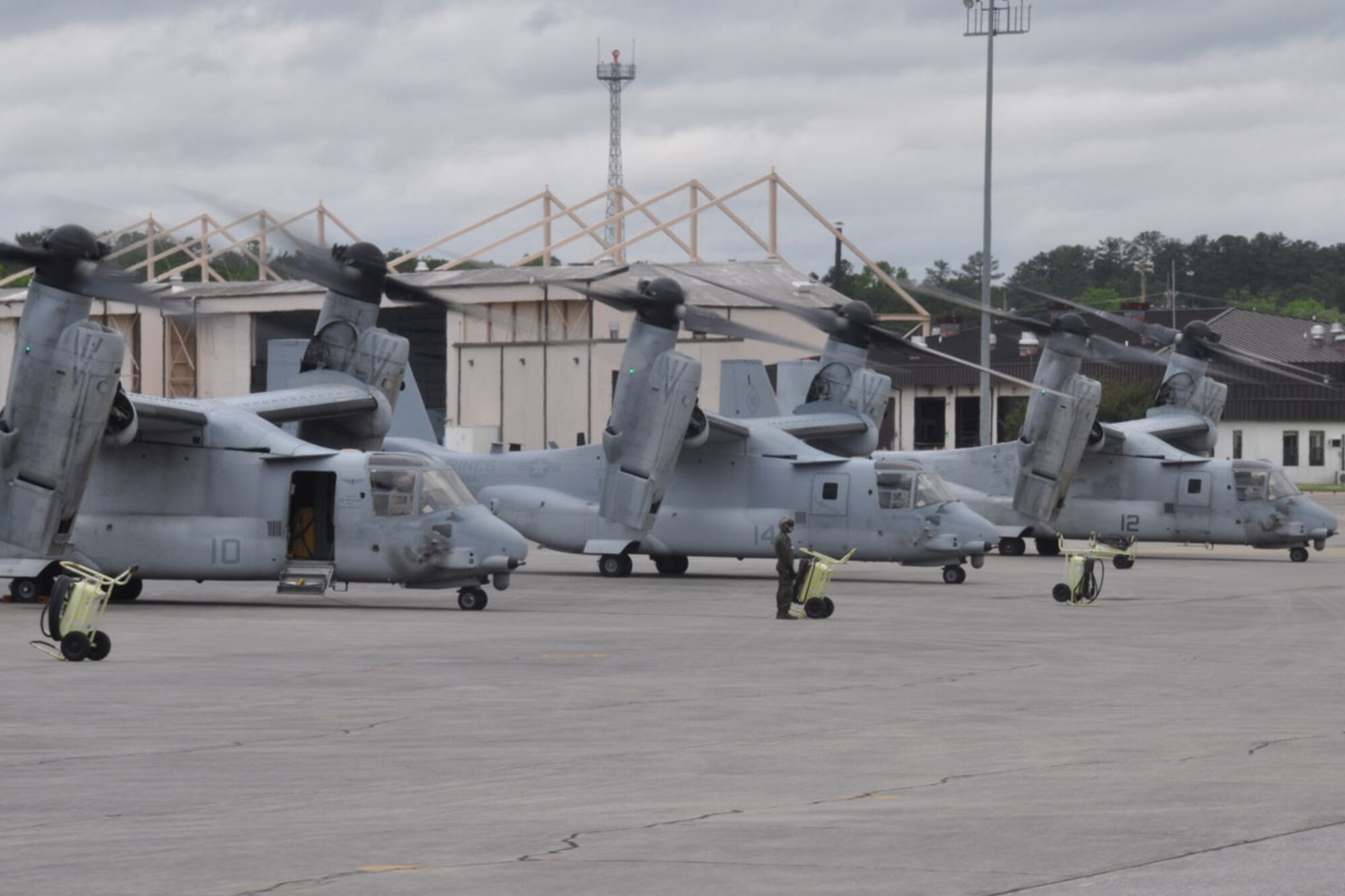 Three MV-22B Osprey aircraft from the Marine Medium Tiltrotom Squadron, 264th Marine Corps Air Station, New River, North Carolina, prepare to take off from Dobbins Air Reserve Base, Ga, April 30. The Marines engaged in a non-combatant evacuation operation, using four MV-22B Ospreys that would take off in pairs, five minutes apart. (U.S. Air Force photo/Senior Airman Miles Wilson)